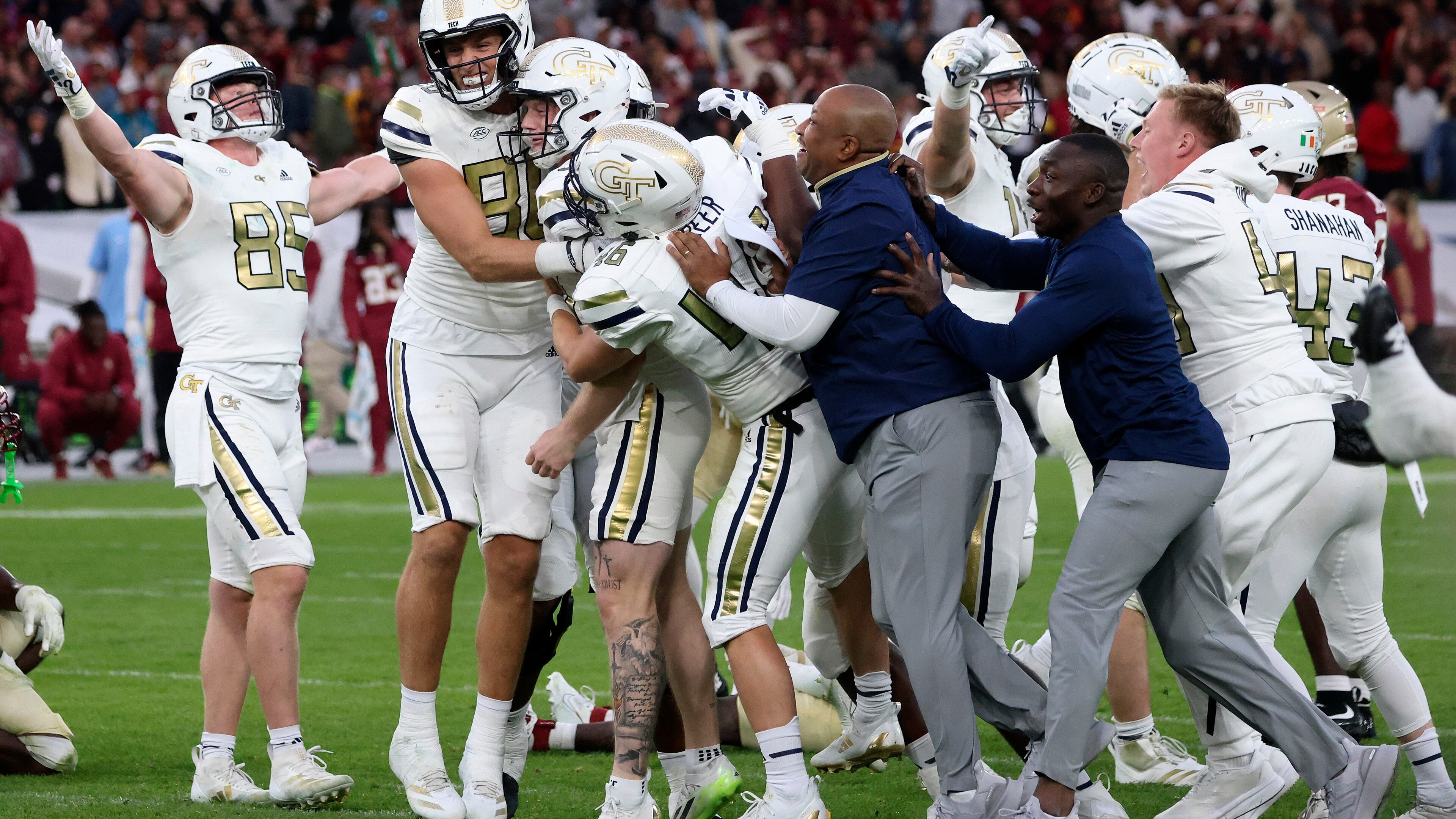 Georgia Tech players celebrate after the Yellow Jackets defeated Florida State at the Aviva Stadium in Dublin, Saturday, Aug. 24, 2024. (AP Photo/Peter Morrison)