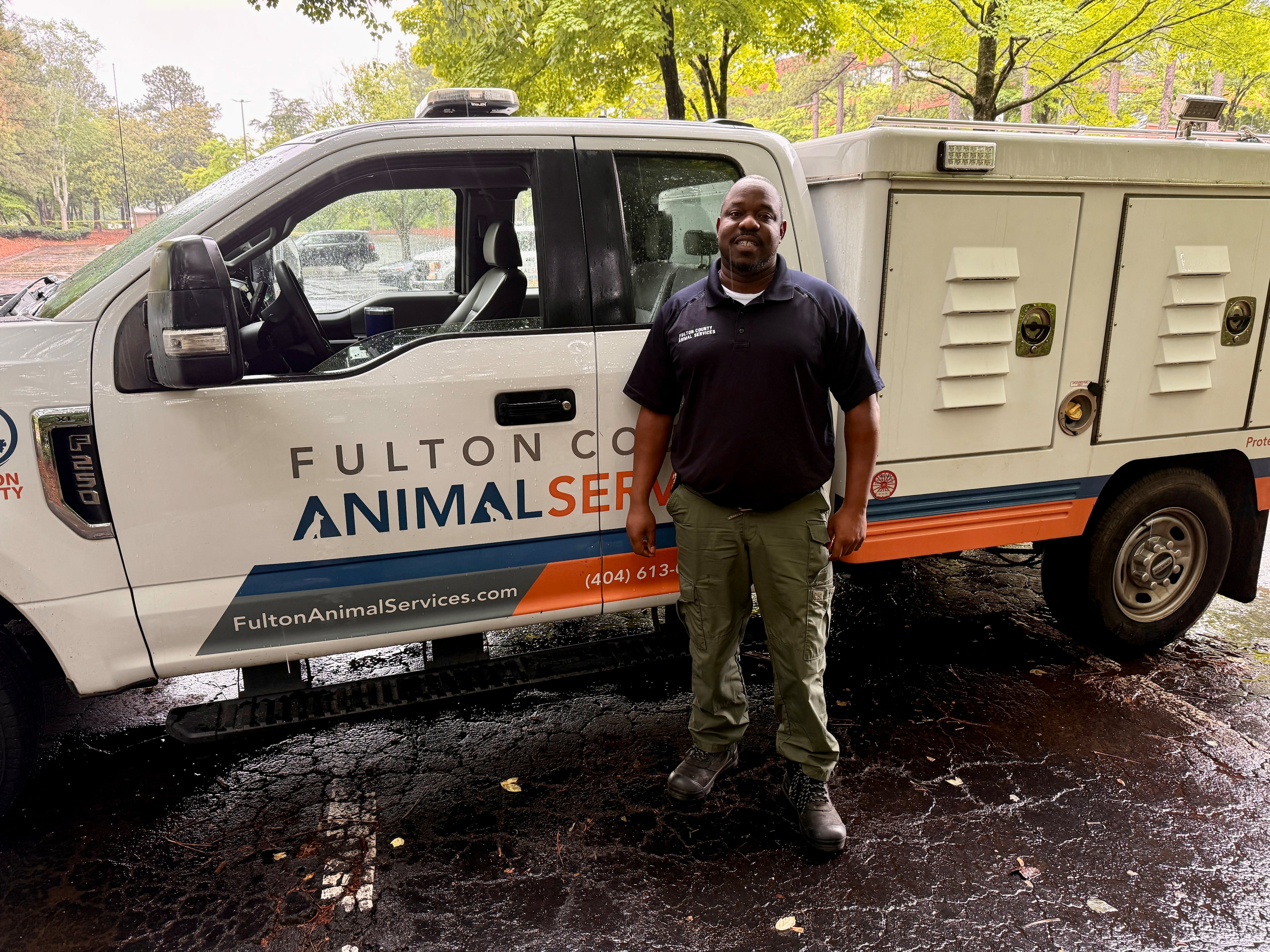George Carter, a field service supervisor for Fulton County Animal Services, was on site at the Economy Hotel in Roswell May 10 to transport any animals that needed to be taken off site after the hotel was shut down. He said roughly 30 animals were living at the hotel. (Danielle Charbonneau/AJC)