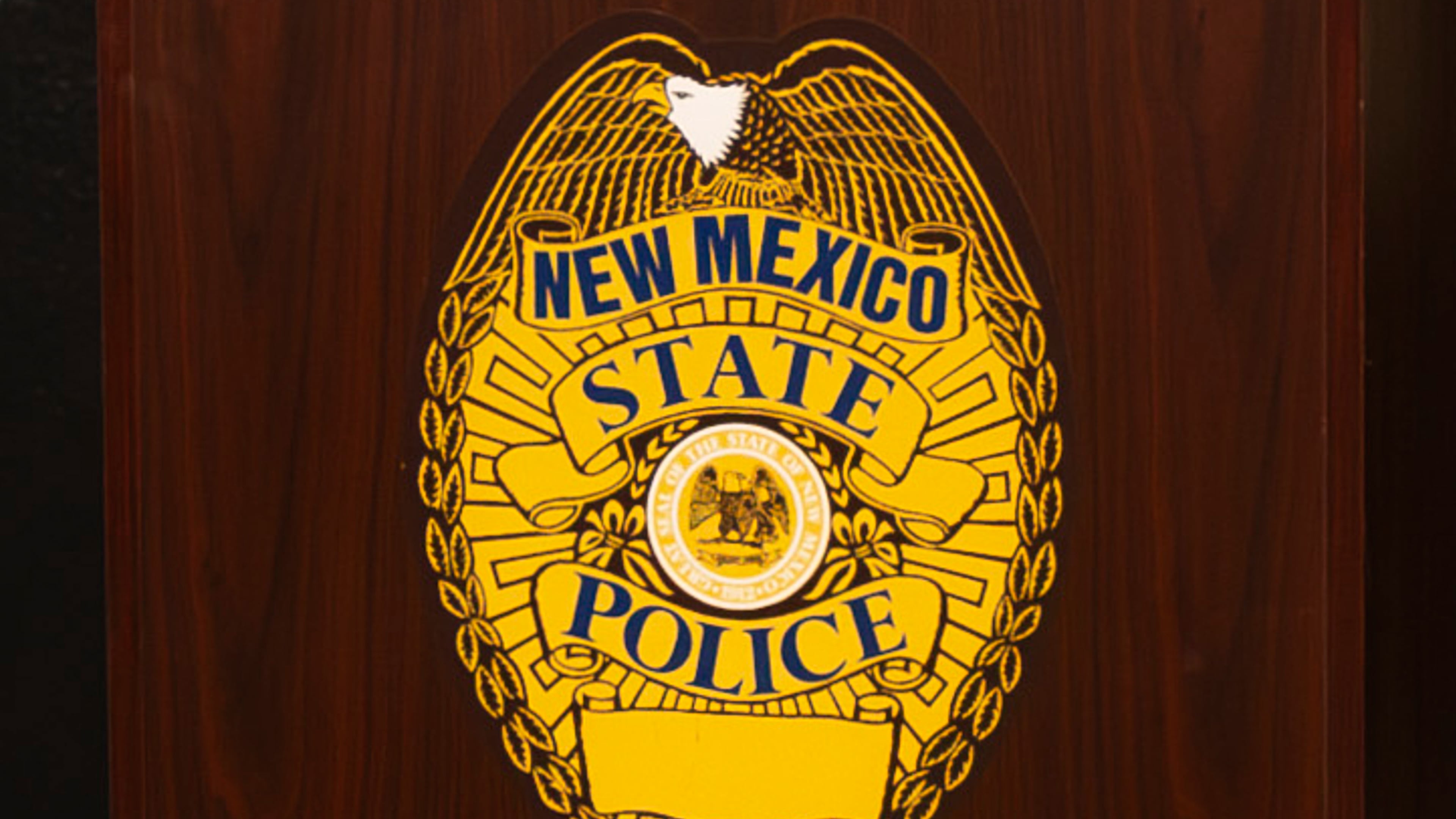 FILE - A New Mexico State Police emblem is displayed on podium during a news conference, March 16, 2024, in Albuquerque, N.M. (Jon Austria/The Albuquerque Journal via AP, File)