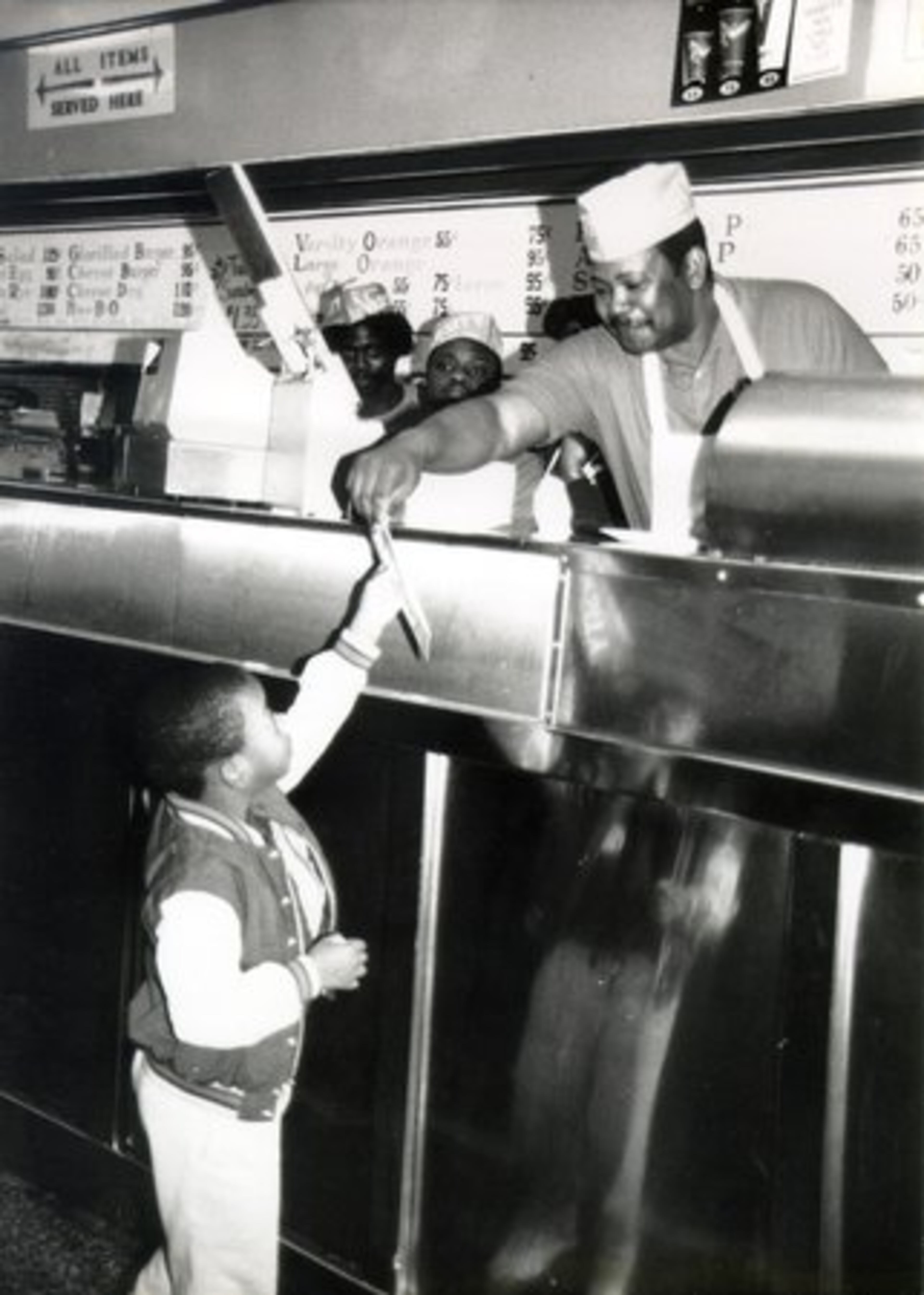 Erby Walker was inducted into the Atlanta Convention and Visitors Bureau Hospitality Hall of Fame in 2003. This photo was taken at at The Varsity in the 1970s.