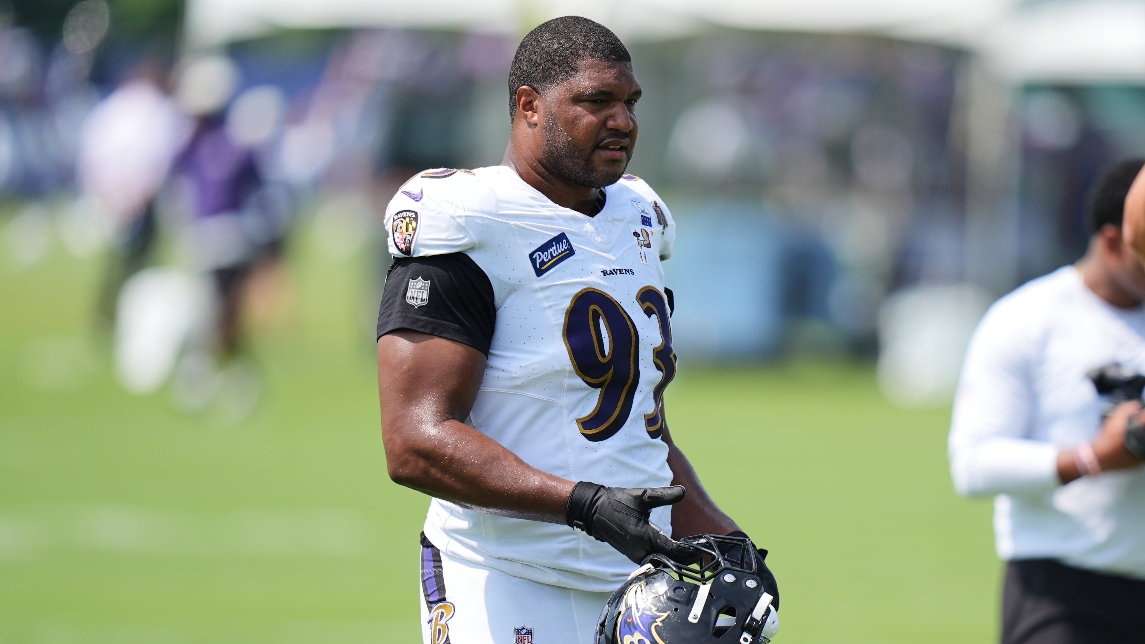 Baltimore Ravens defensive end Calais Campbell (93) watches during the team's NFL football training camp, Tuesday, Aug. 11, 2026, at the Under Armour Performance Center in Owings Mills, Md. (AP Photo/Stephanie Scarbrough)