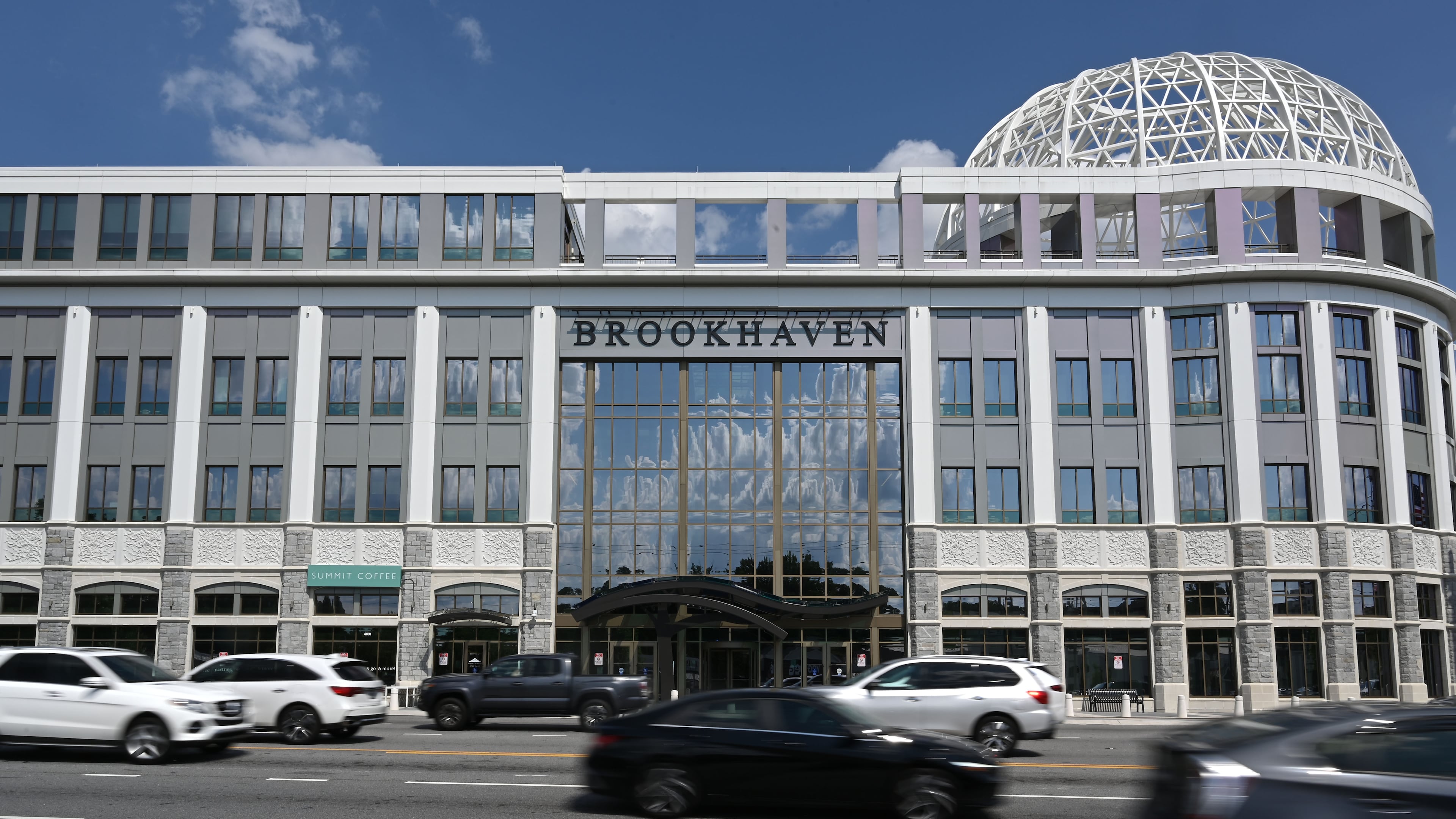 Traffice moves past Brookhaven City Centre on Friday, June 26, 2026. The Brookhaven City Council unanimously approved a 40% hike in the city’s property tax rate earlier this week. (Hyosub Shin/AJC)