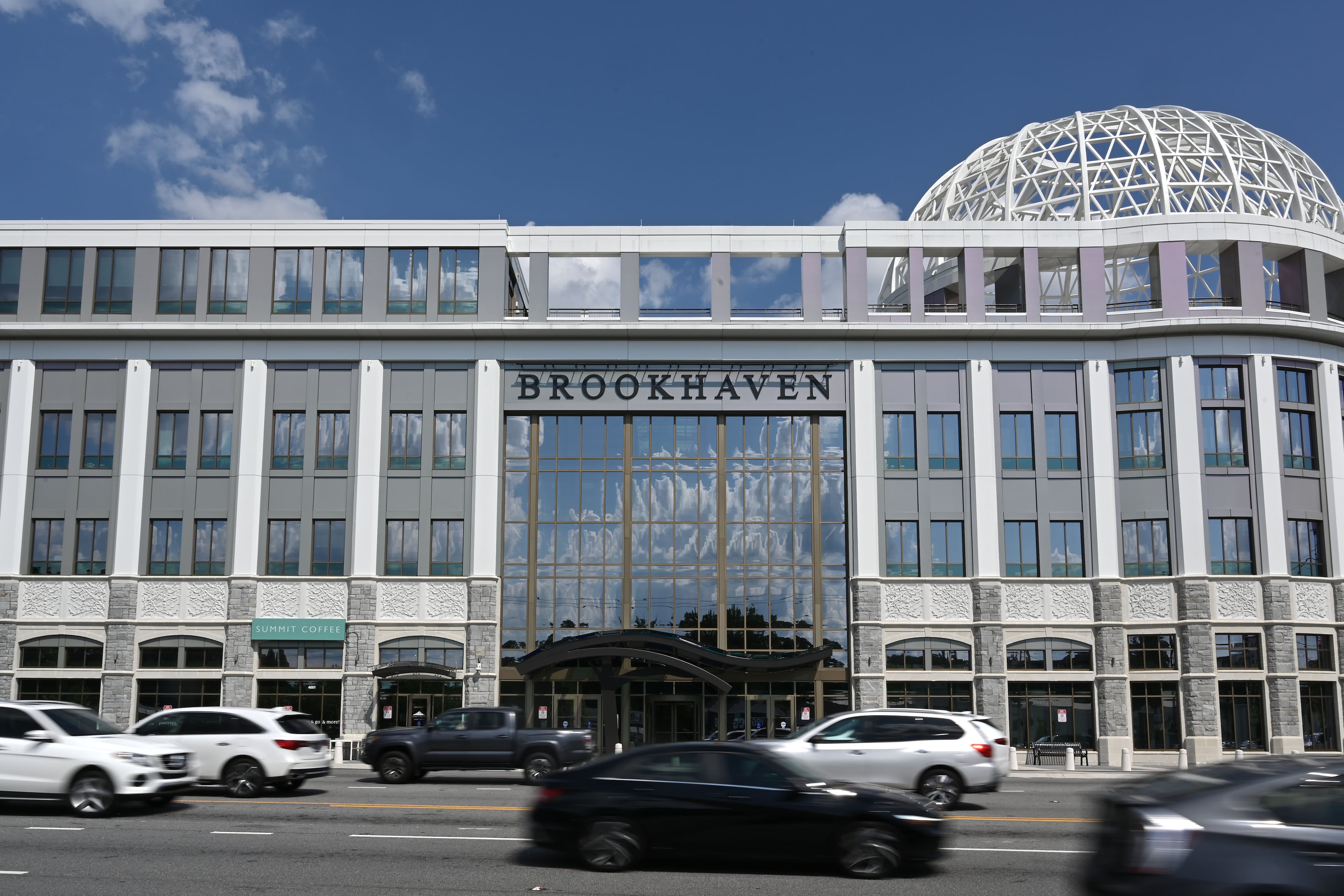 Traffice moves past Brookhaven City Centre on Friday, June 26, 2026. The Brookhaven City Council unanimously approved a 40% hike in the city’s property tax rate earlier this week. (Hyosub Shin/AJC)