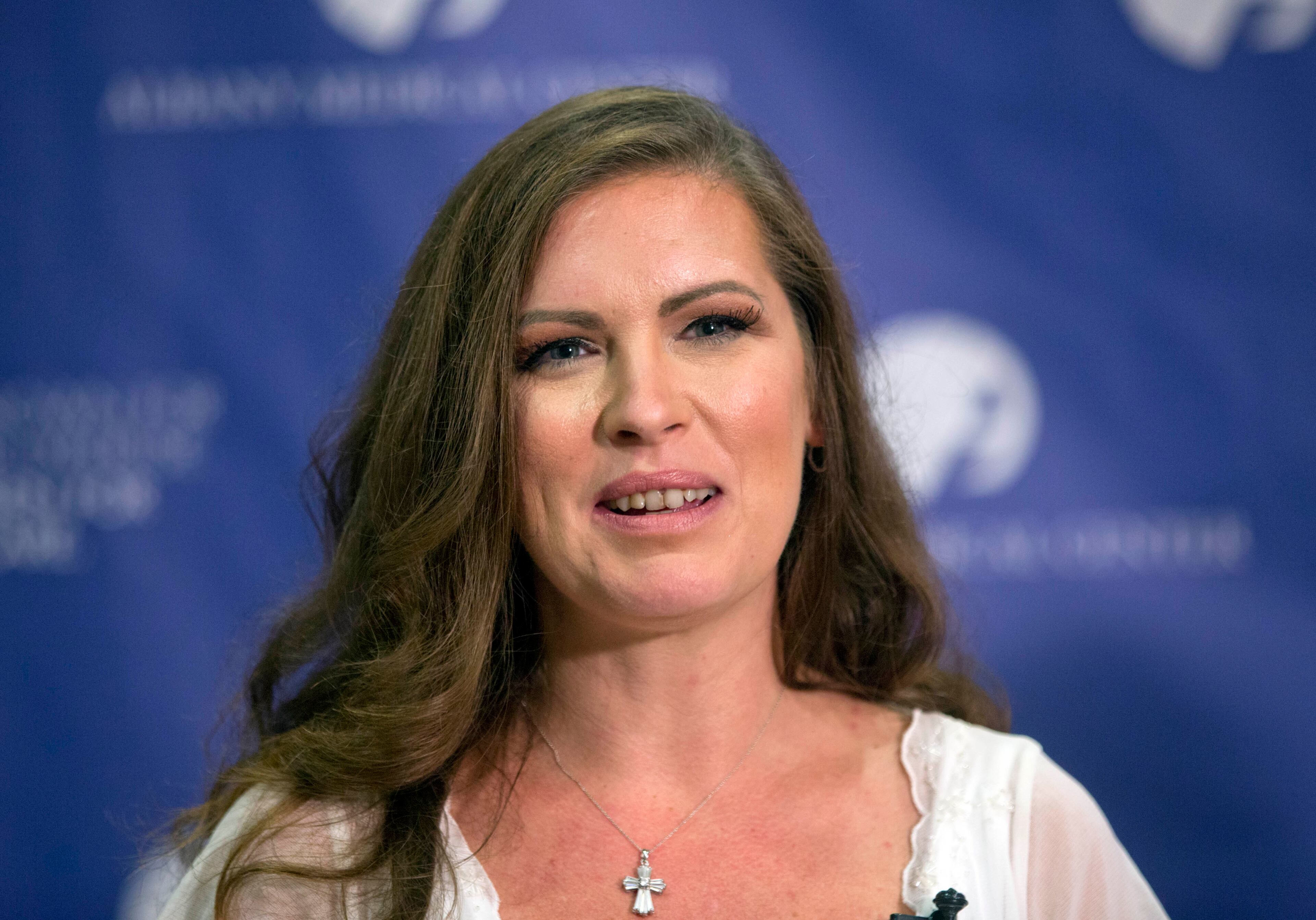 Amanda Scarpinati speaks during a news conference at Albany Medical Center on Sept. 29, 2015, in Albany, N.Y. The upstate New York woman who suffered severe burns as an infant is finally getting the chance to thank the hospital nurse who cared for her, thanks to a social media posting that revealed the identity of the nurse in 38-year-old photos.