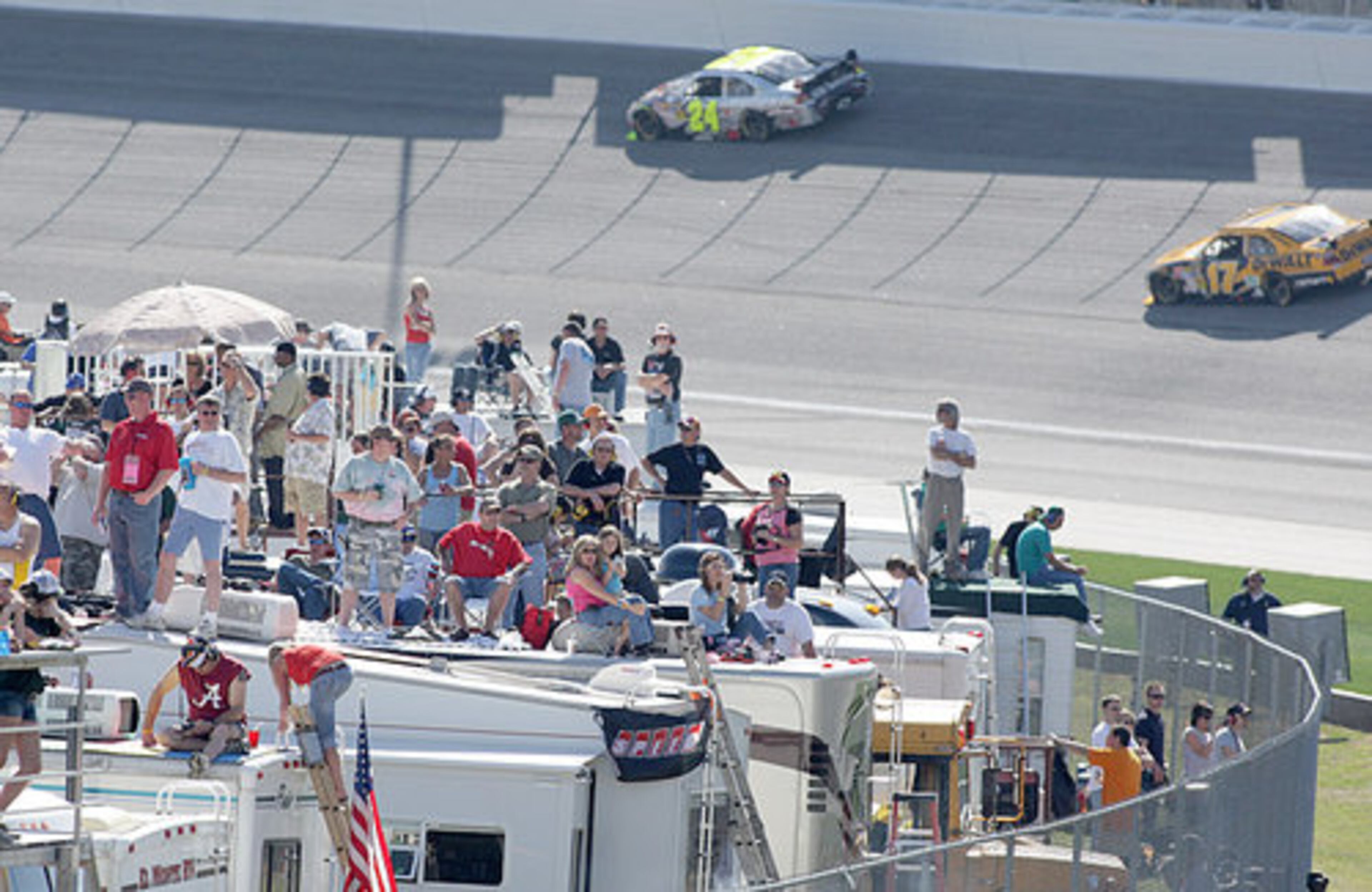 Fans catch the action from atop campers in the infield at Atlanta Motor Speedway.
