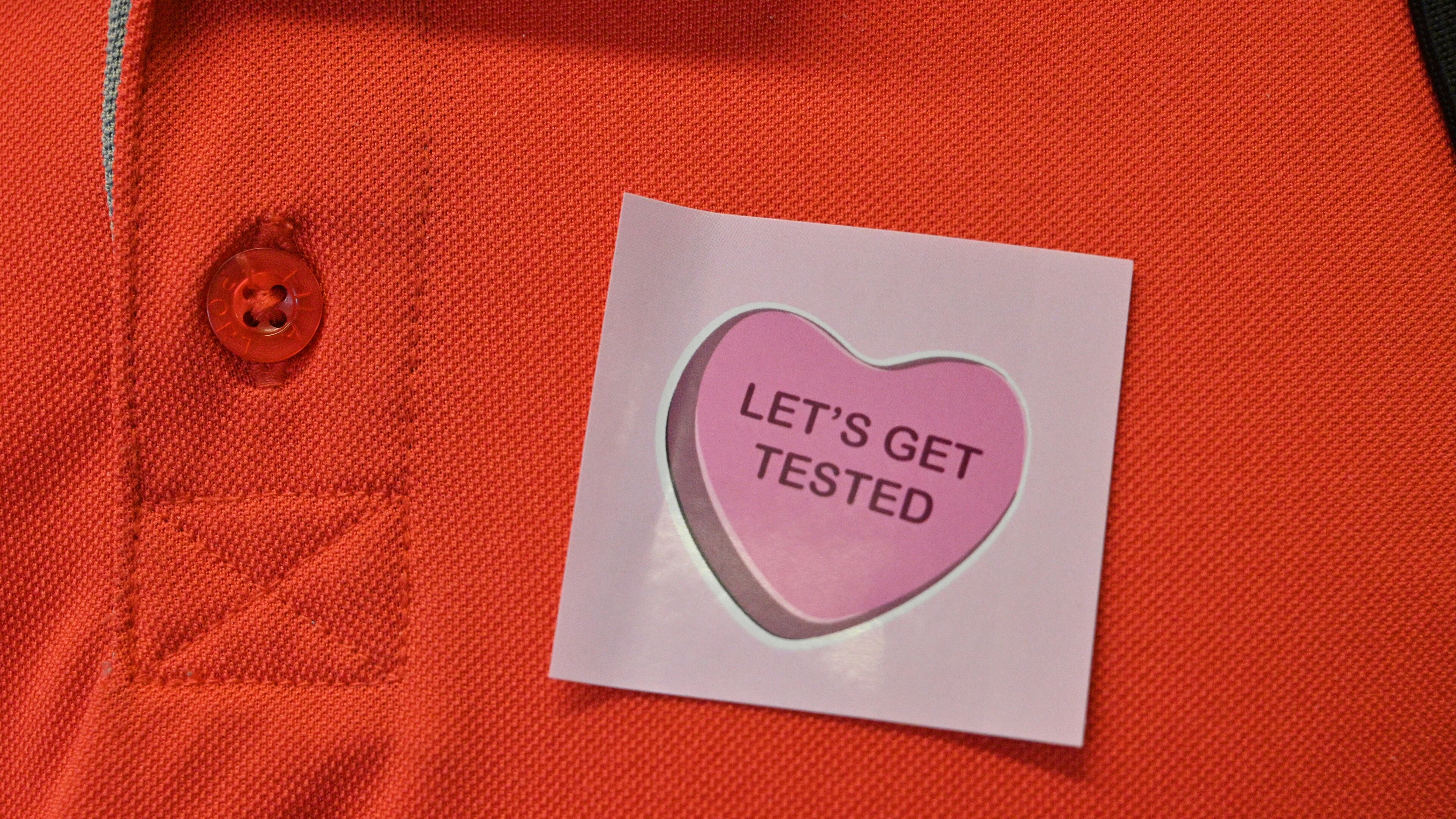 January 4, 2022 Atlanta - Georgia Tech employee Donald Smith gets a sticker after he submitted his saliva sample for PCR COVID-19 test at Georgia Tech’s Economic Development Building on Tuesday, January 4, 2022. (Hyosub Shin / Hyosub.Shin@ajc.com)