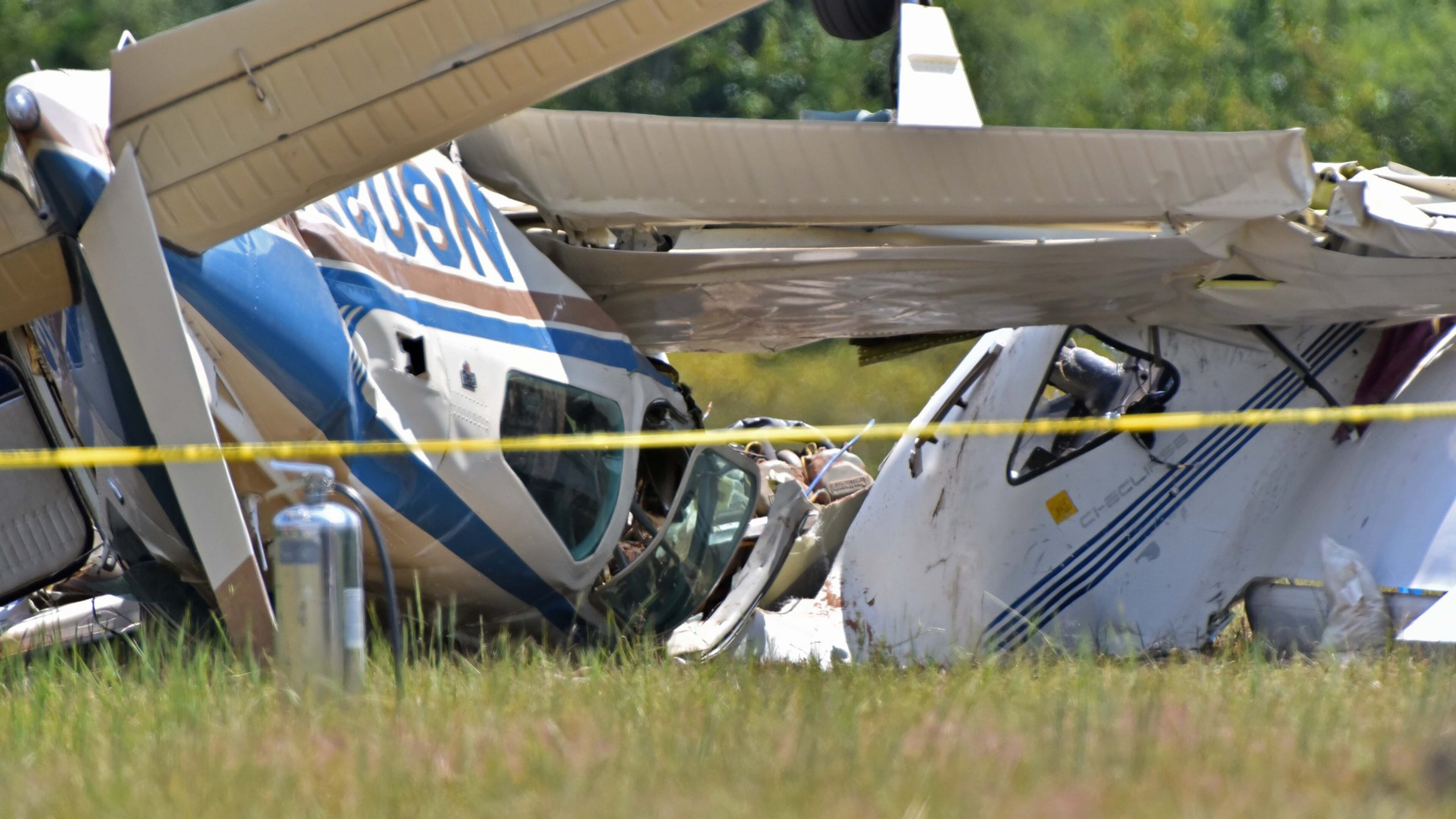 Authorities investigate at the scene where 3 people were killed after two planes collided at West Georgia Regional Airport in Carrollton on Wednesday, September 7, 2016. One aircraft was a Diamond Aircraft DA20C1 and the other was a 1978 Beechcraft Bonanza. The airport has no air-traffic controllers, and no control tower, Channel 2 Action News reported. Pilots communicate on a shared frequency. HYOSUB SHIN / HSHIN@AJC.COM