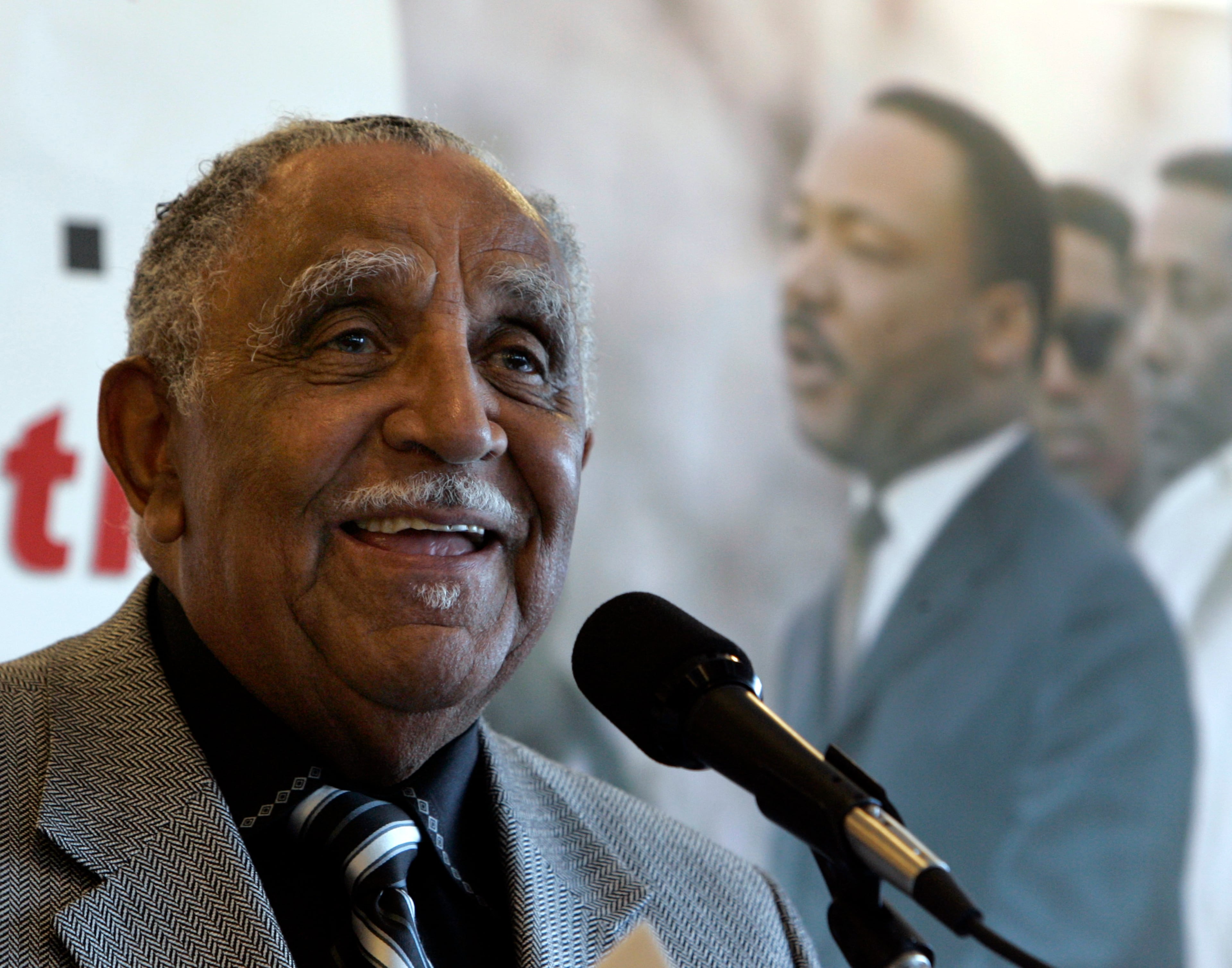 Rev. Joseph E. Lowery speaks at the National Press Club in Washington in 2008. In the background is an image of Rev. Dr. Martin Luther King Jr. (AP Photo/Susan Walsh, File)