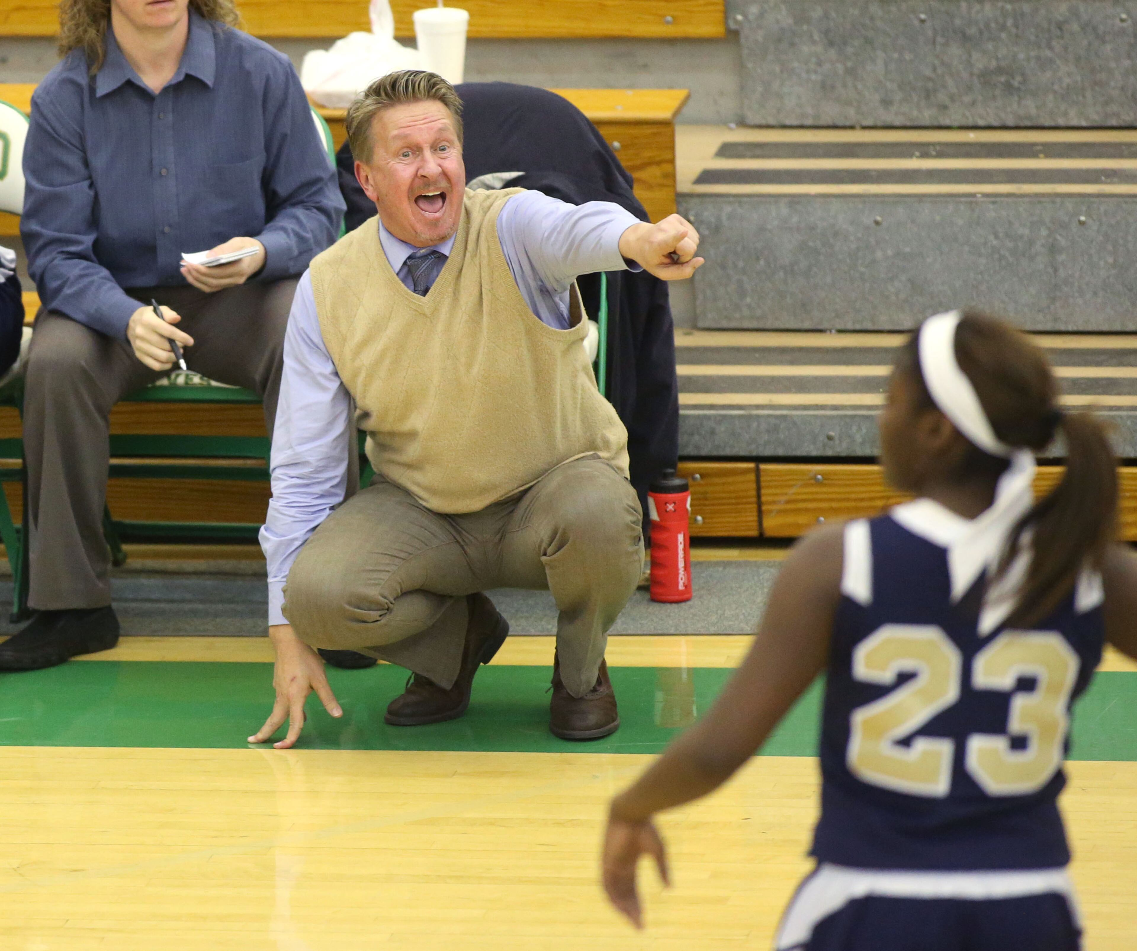 Decatur coach Bill Roberts directs Kayla Thomas (23) during their game Monday night in Buford. JASON GETZ / SPECIAL