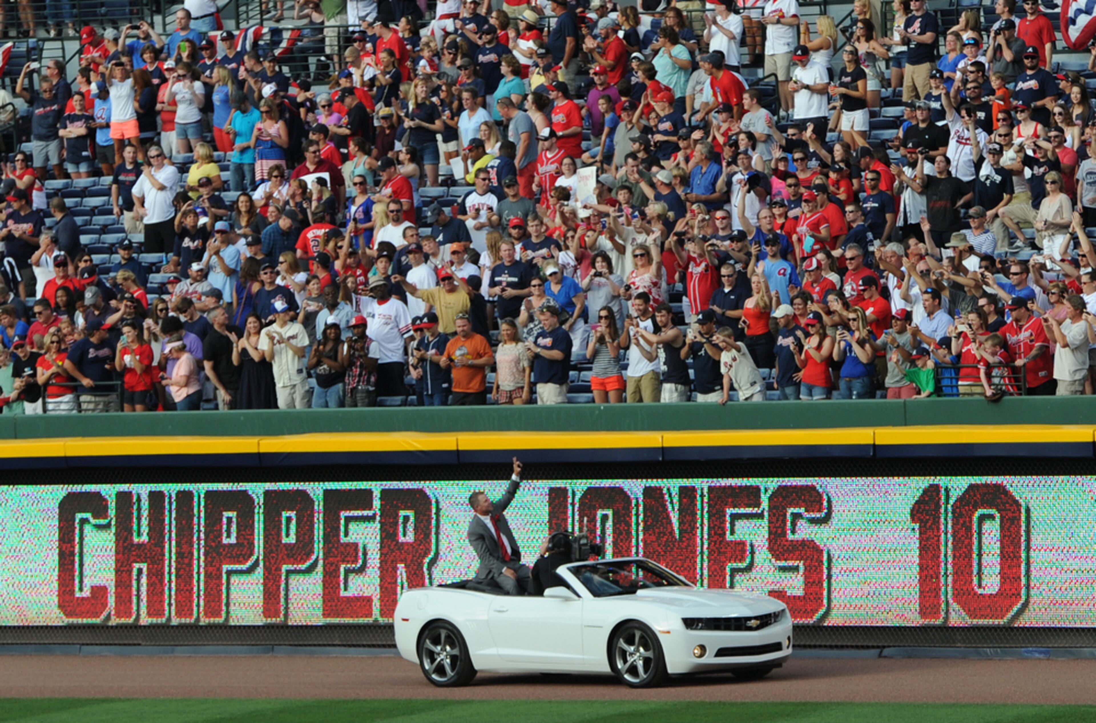 CHIPPER HONORED--June 28, 2013 -ATLANTA: Chipper Jones waves to fans while being driven around the field in a car after the ceremony to retire his number 10 at Turner Field on Friday, June 28, 2013. JOHNNY CRAWFORD / JCRAWFORD@AJC.COM