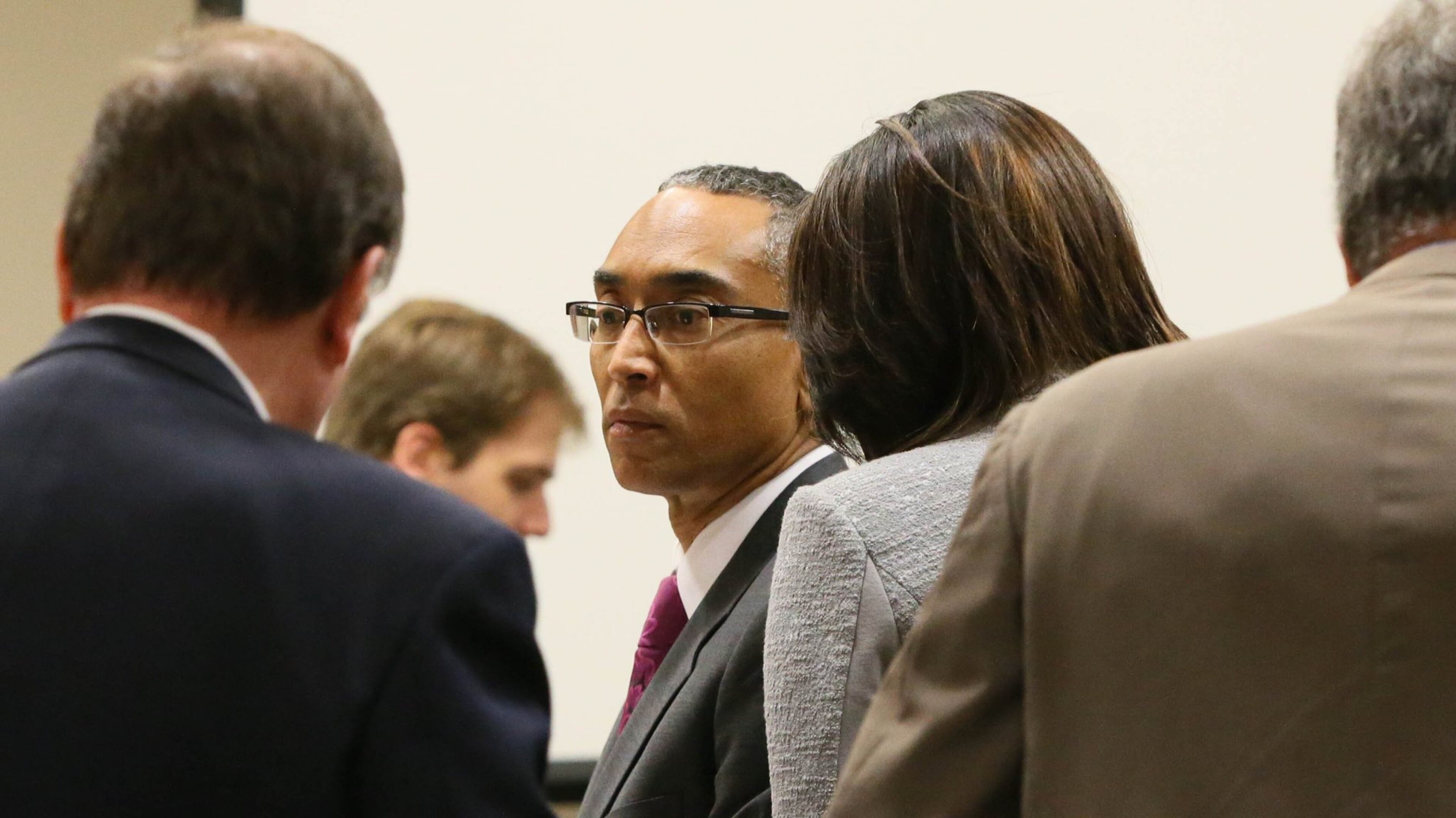 September 29, 2014 - Decatur - Suspended Dekalb County CEO Burrell Ellis stands with his attorneys as Judge Courtney L. Johnson goes into recess to consider an objection to the testimony of David Lee, an engineer with AT&T, who testified about cell phone towers in the trial before Judge Courtney L. Johnson in DeKalb County Superior Court. Prosecutors are nearing the end of their witness list in the Burrell Ellis trial. Ellis’s attorneys are expected to began presenting his defense this afternoon. BOB ANDRES / BANDRES@AJC.COM