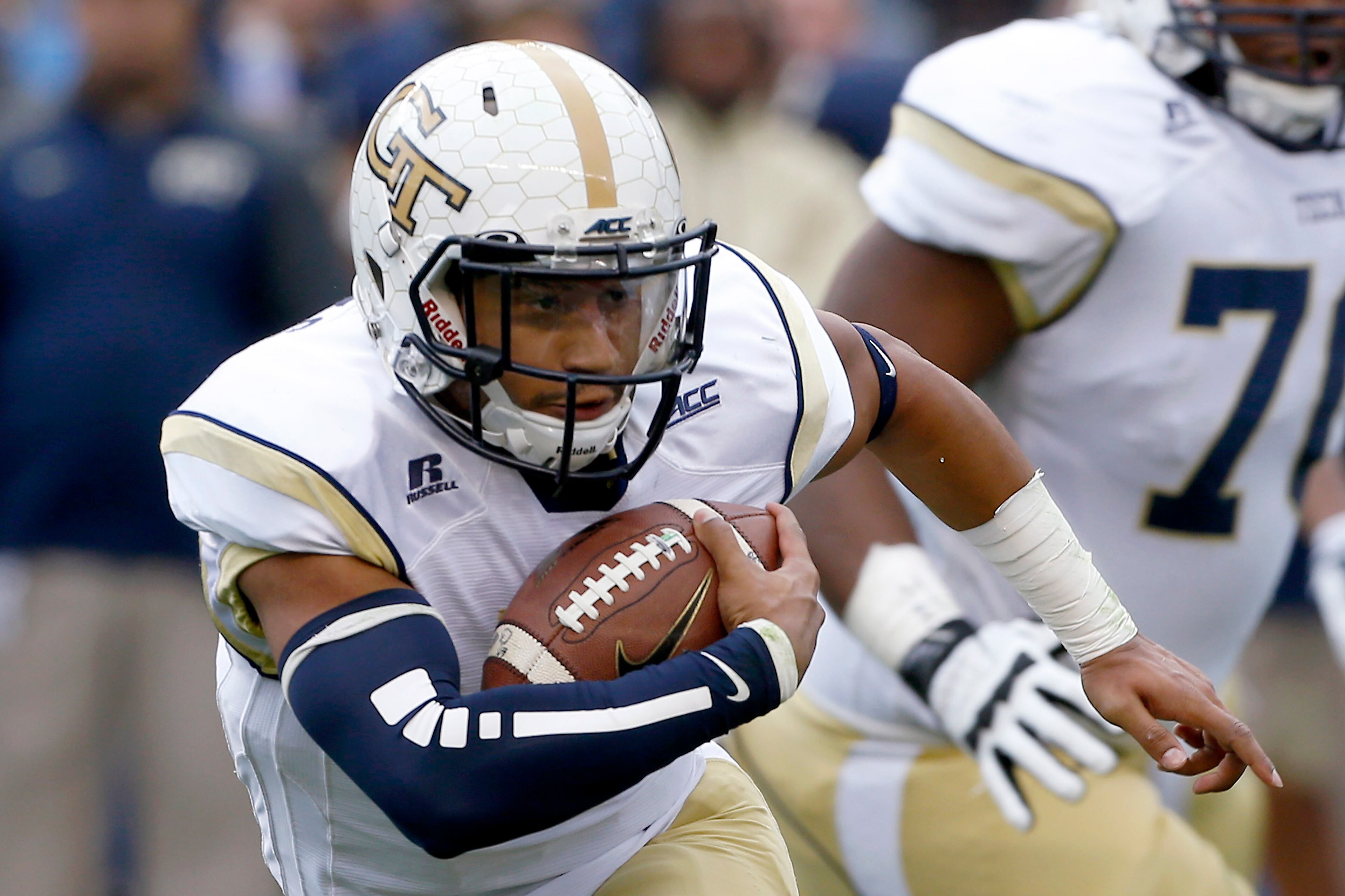 Georgia Tech quarterback Justin Thomas (5) runs in the first quarter of an NCAA football game against Pittsburgh, Saturday, Oct. 25, 2014 in Pittsburgh. (AP Photo/Keith Srakocic)