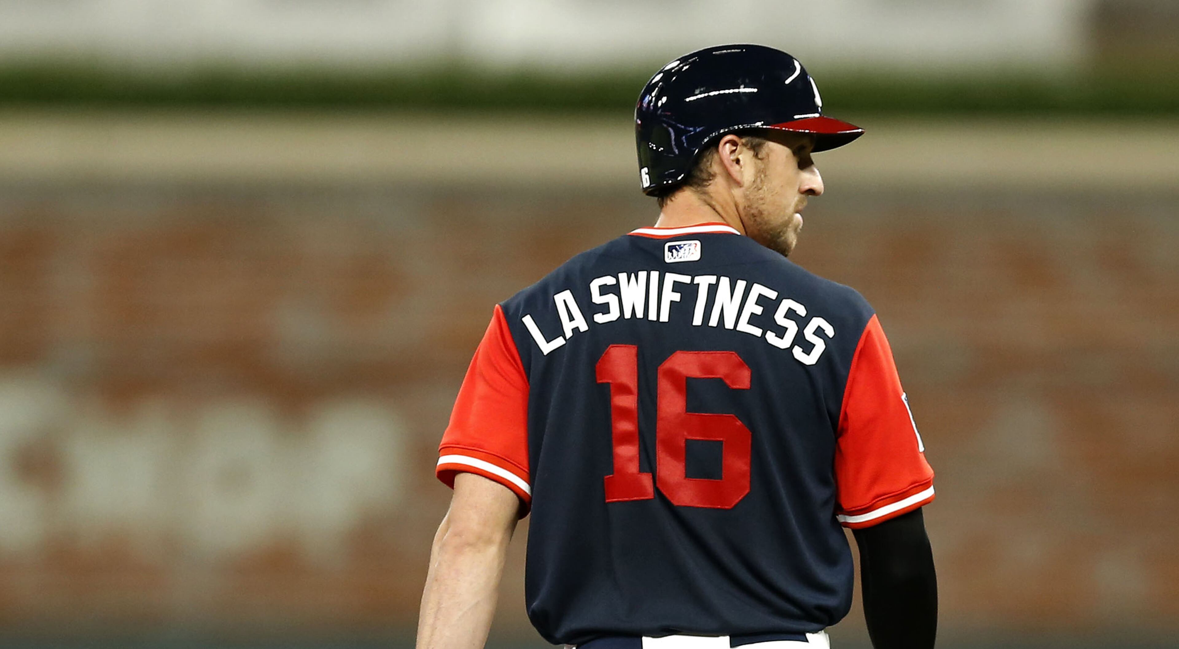 ATLANTA, GA - AUGUST 25: Pinch runner Lane Adams #16 of the Atlanta Braves, with the nickname "LA Swiftness" on the back of his shirt, walks back to second base in the eighth inning during the game against the Colorado Rockies at SunTrust Park on August 25, 2017 in Atlanta, Georgia. (Photo by Mike Zarrilli/Getty Images)