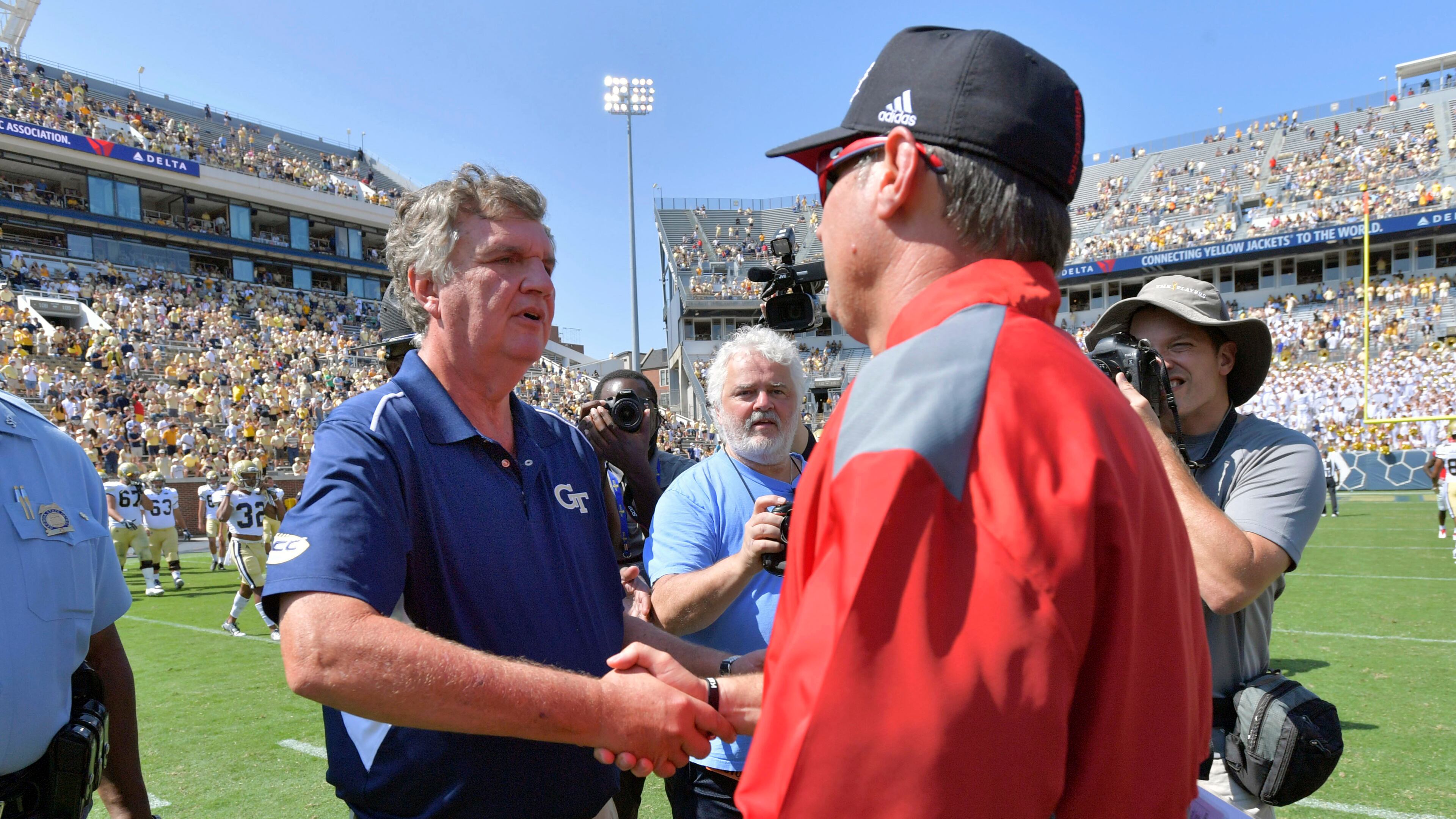 Georgia Tech head coach Paul Johnson, left, and Jacksonville State head coach John Grass shake hands following an NCAA college football game, Saturday, Sept. 9, 2017 in Atlanta. Georgia Tech defeated Jacksonville St. 37-10. (Hyosub Shin/Atlanta Journal-Constitution via AP)