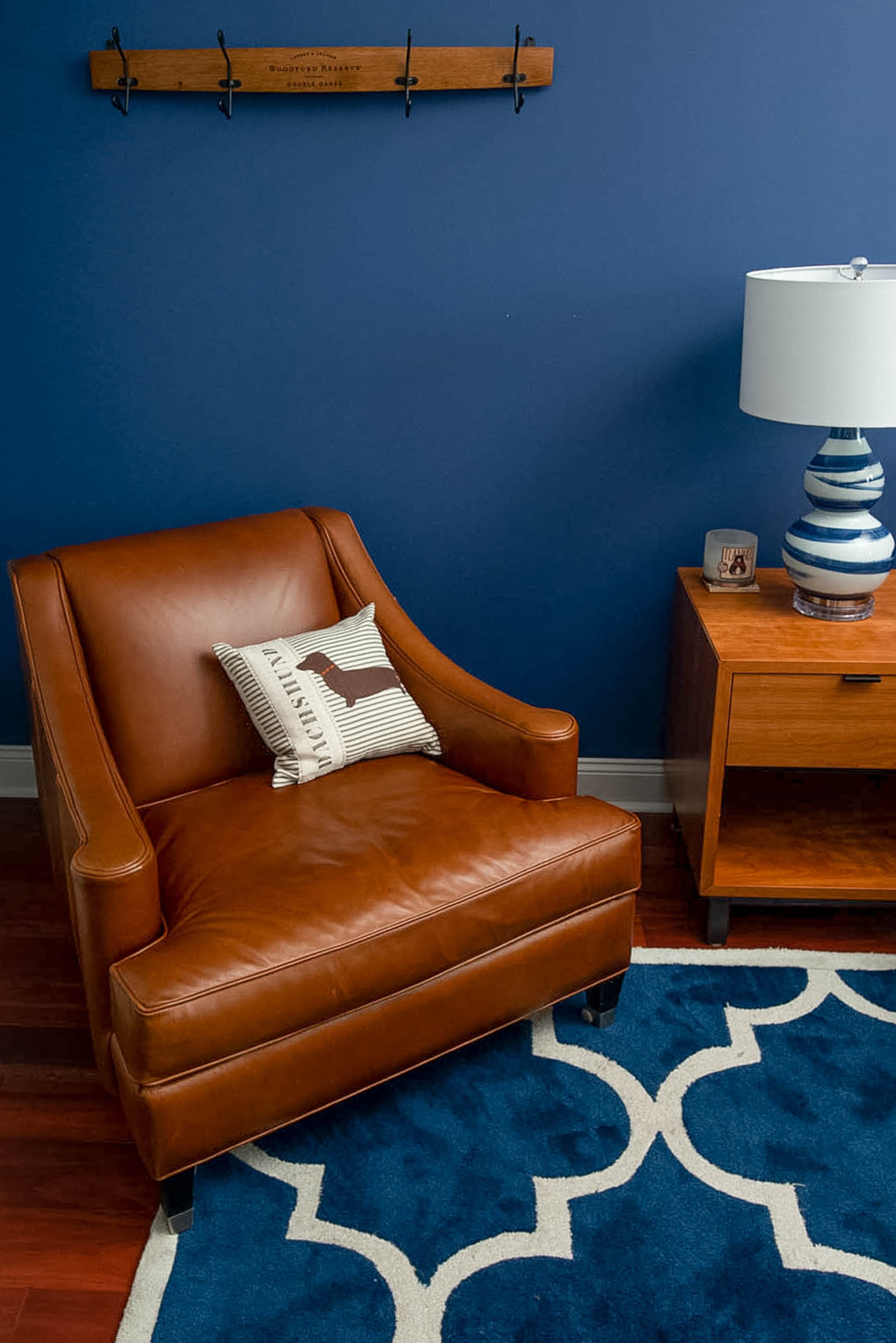 The master bedroom is awash in blue. The bedroom suite, which has a cherry finish, is from the Copenhagen collection by Room & Board. The pillows are a fun nod to their pets. The painting, titled âNacimiento,â is by a Hispanic artist and depicts the nativity. Text by Marena Galluccio and Lori Johnston/Fast Copy News Service. (Christopher Oquendo www.ophotography.com)