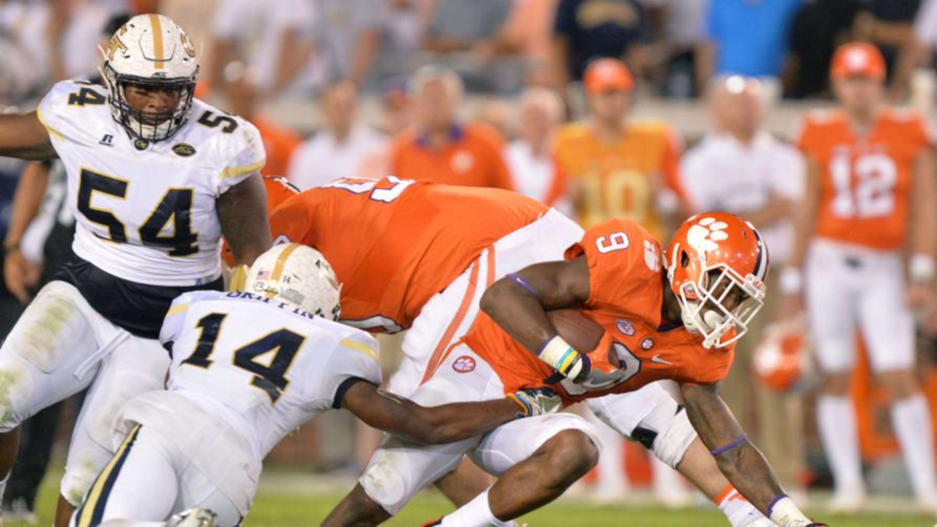 September 22, 2016 Atlanta - Clemson Tigers running back Wayne Gallman (9) eludes a tackle by Georgia Tech Yellow Jackets defensive back Corey Griffin (14) in the second half at Bobby Dodd Stadium on Thursday, September 22, 2016. Clemson Tigers won 26 - 7 over the Georgia Tech Yellow Jackets. HYOSUB SHIN / HSHIN@AJC.COM