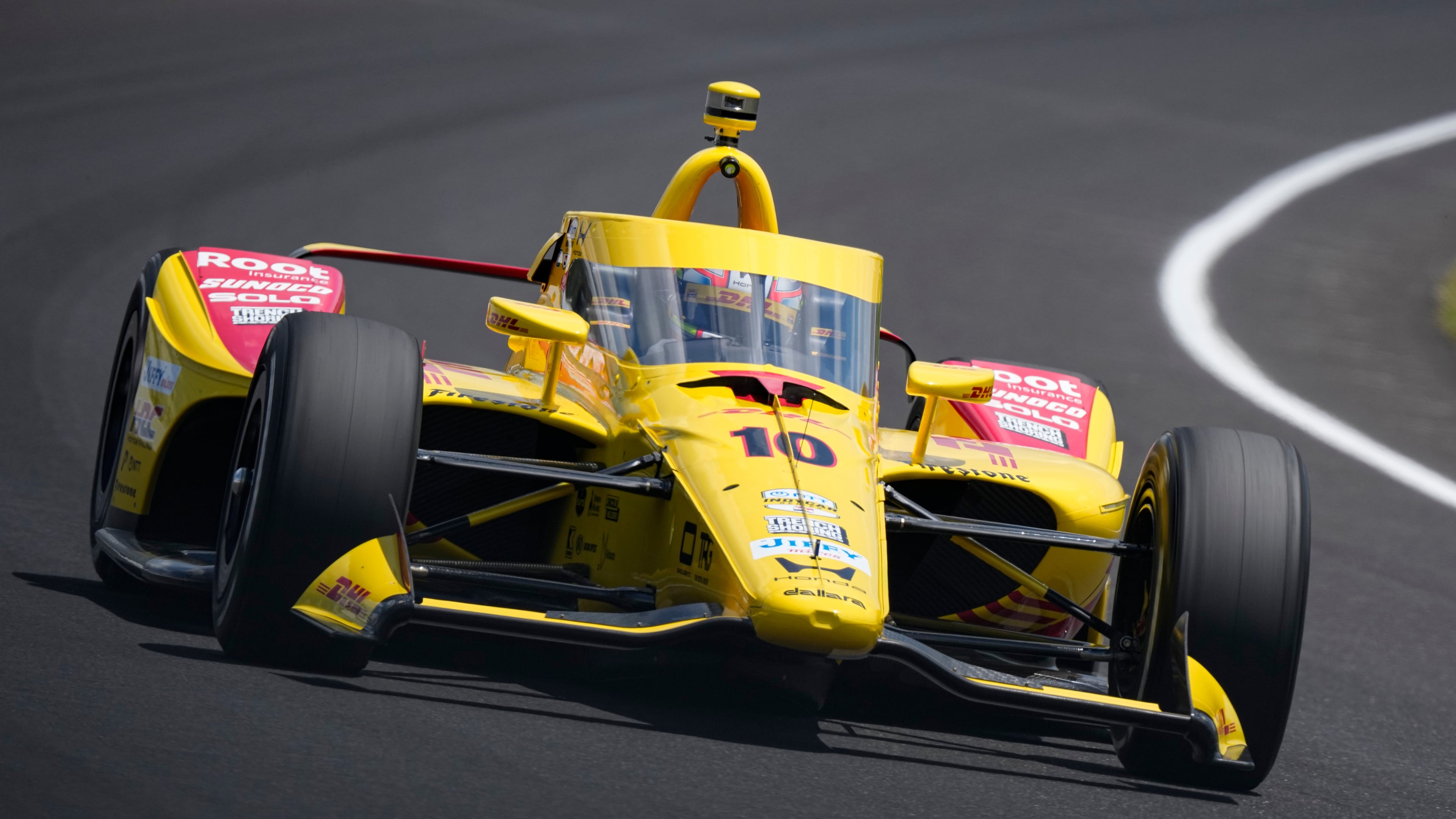 Alex Palou, of Spain, drives through the third turn during qualifications for the Indianapolis 500 auto race at the Indianapolis Motor Speedway in Indianapolis, Sunday, May 17, 2026. (AP Photo/Michael Conroy)