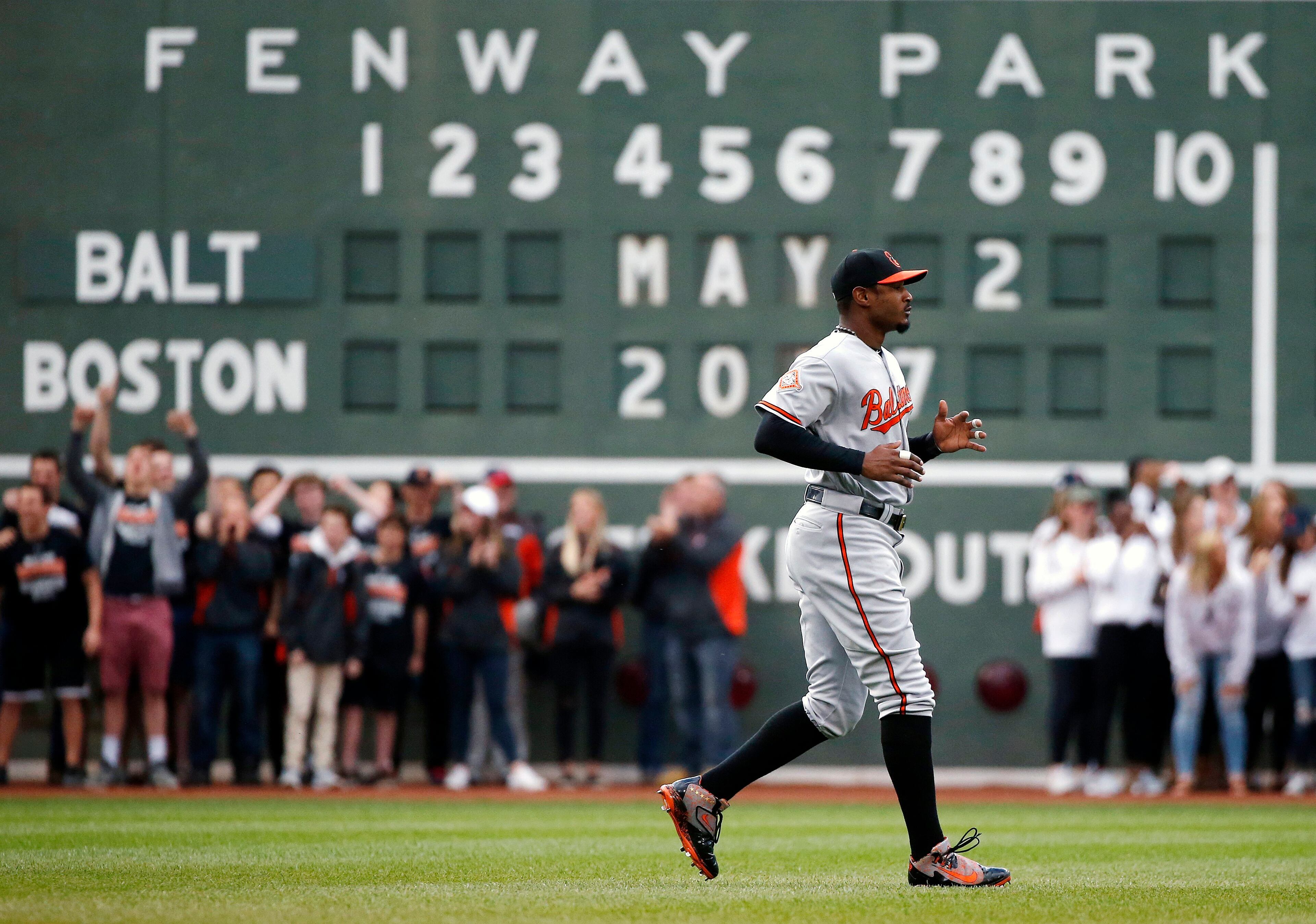 Baltimore Orioles' Adam Jones warms up before a baseball game against the Boston Red Sox, Tuesday, May 2, 2017, in Boston. Jones called the incident in which he said fans inside Fenway Park yelled racial slurs at him and threw a bag of peanuts in his direction was "unfortunate," with no place in today's game. Jones called the incident in which he said fans inside Fenway Park yelled racial slurs at him and threw a bag of peanuts in his direction was "unfortunate," with no place in today's game. Red Sox team president Sam Kennedy said 34 people were ejected for various reasons Monday night and reiterated the team's "zero tolerance" policy for such incidents. He also said there would be extra security around the outfield on Tuesday night. (AP Photo/Michael Dwyer)