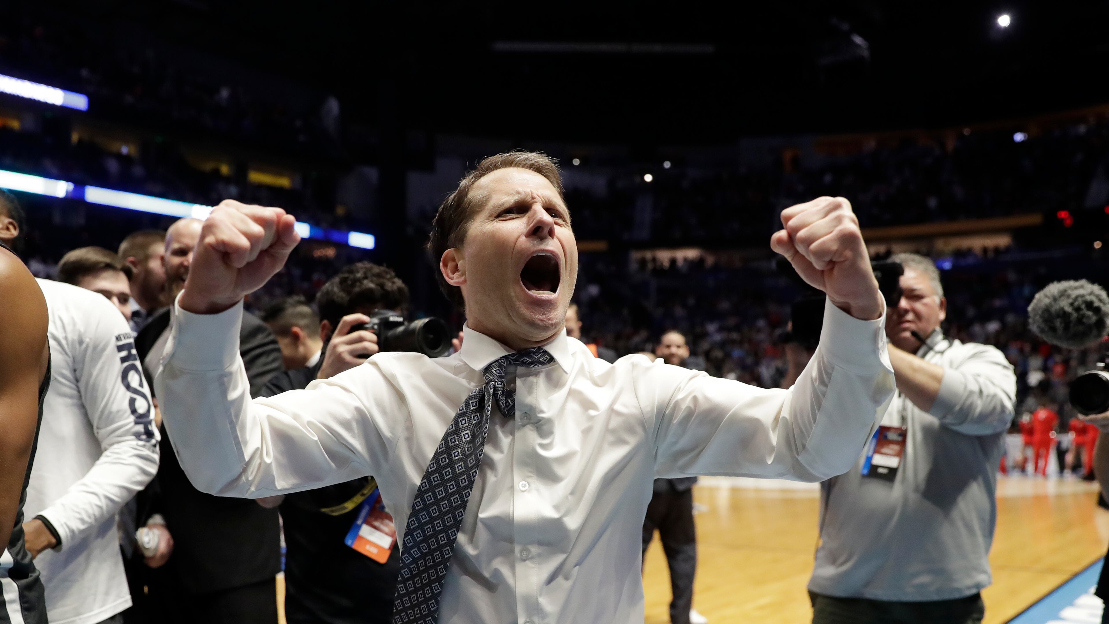 Nevada head coach Eric Musselman celebrates as his team defeated Cincinnati during a second-round game in the NCAA college basketball tournament in Nashville, Tenn., Sunday, March 18, 2018. Nevada defeated Cincinnati 75-73. (AP Photo/Mark Humphrey)