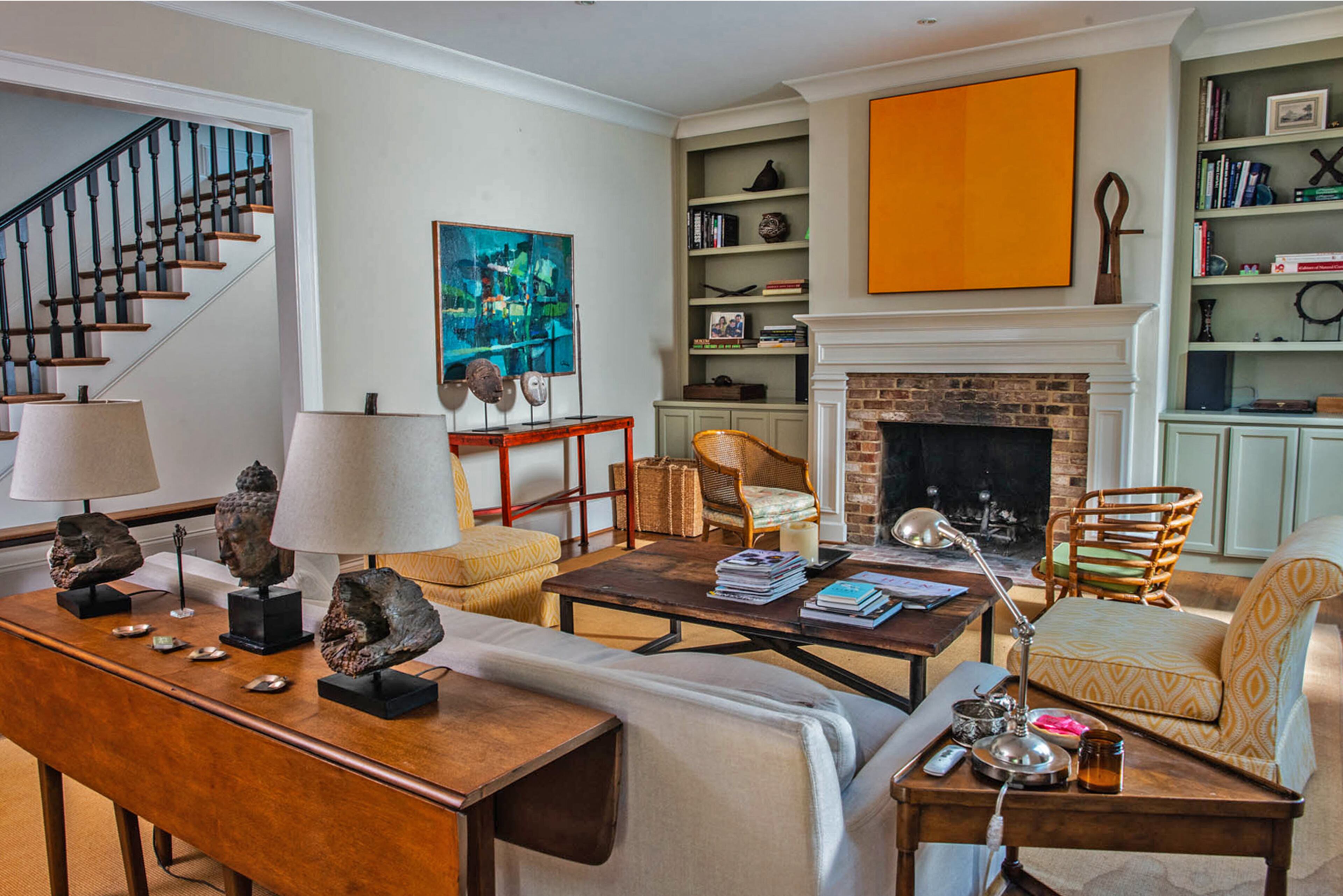 The artwork over the fireplace is a polarizing piece that Hadi Irvani said he appreciates for its sense of energy. "You either hate it or you love it," he said. Most of the furniture in the great room is from Scott Antique Market while the couch is from RH.