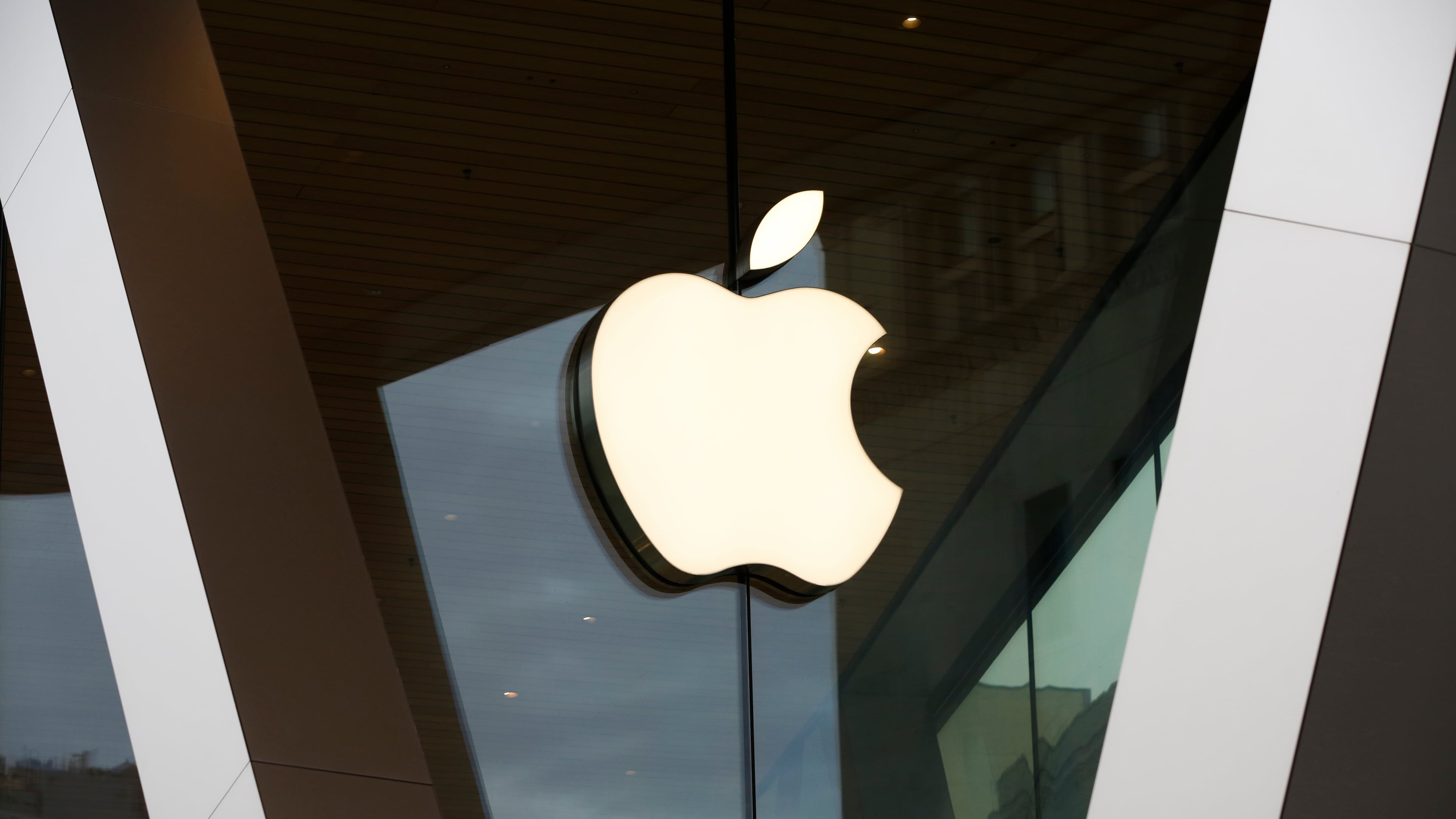 FILE - An Apple logo adorns the facade of the downtown Brooklyn Apple store on March 14, 2020, in New York. (AP Photo/Kathy Willens, File)