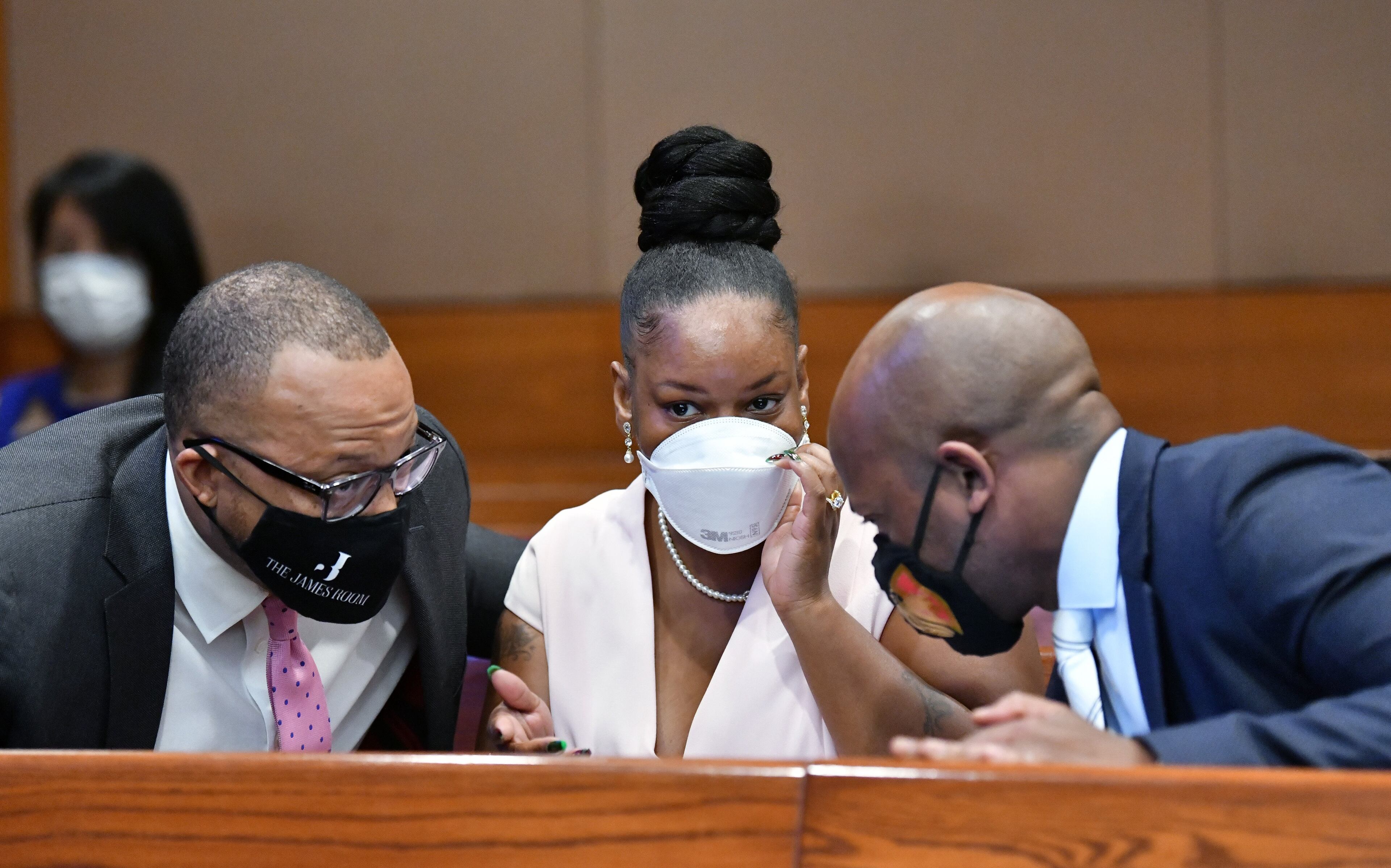 Rayshard Brooks' widow Tomika Miller (center) confers with family attorneys Justin Miller (left) and L. Chris Stewart (right), of Stewart Trial Attorneys, before a press conference at Fulton County Superior Courthouse on Wednesday, June 17, 2020. Fulton County D.A. Paul Howard announced that Garrett Rolfe, the former Atlanta police officer who shot and killed Rayshard Brooks, was charged Wednesday with felony murder and 10 other offenses in his death, the Fulton County District Attorney’s Office said. (Hyosub Shin / Hyosub.Shin@ajc.com)
