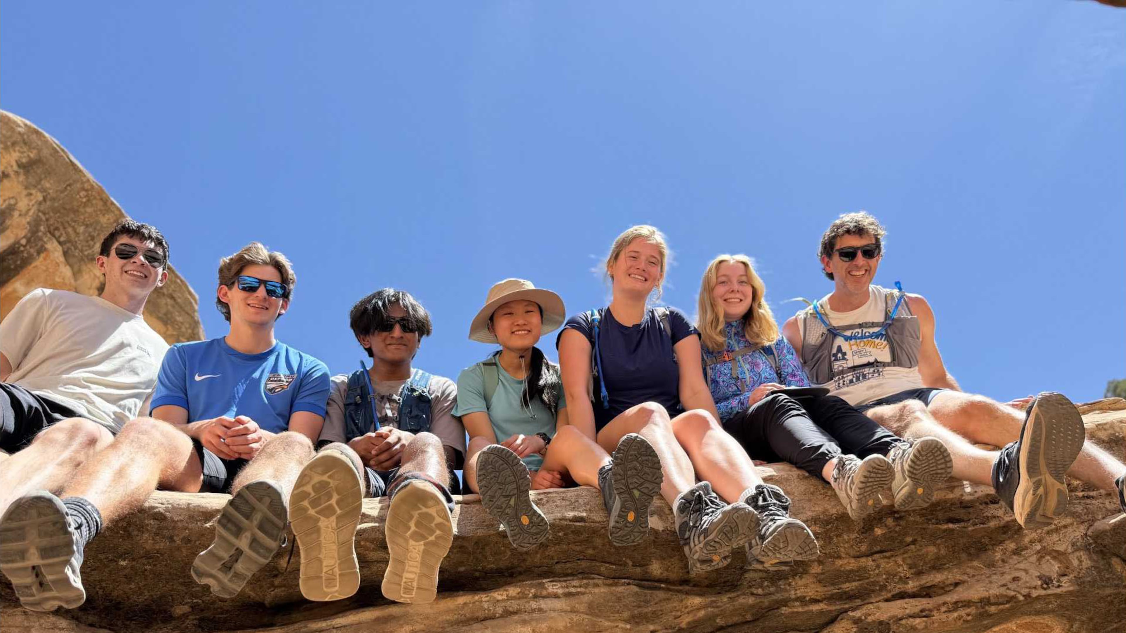 Emory University students pose for a picture with their chaplain, Brent Huckaby (right), in Utah’s Capitol Reef National Park. (Courtesy)