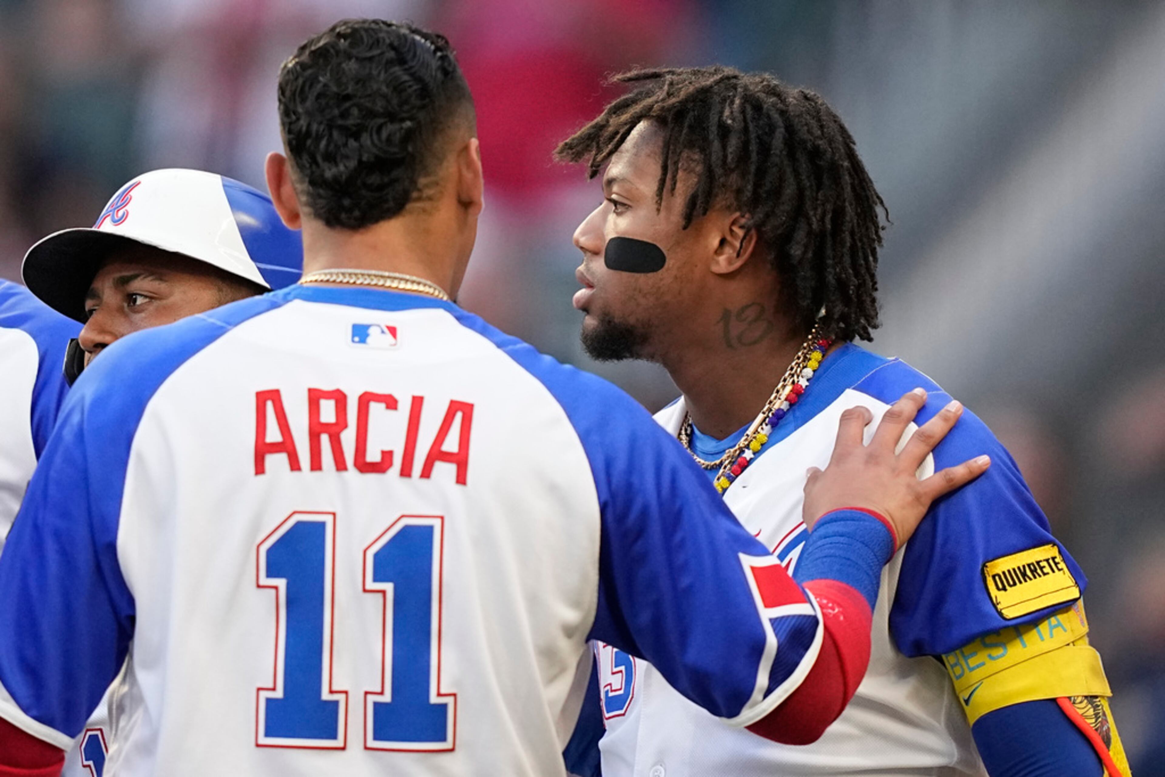 Atlanta Braves right fielder Ronald Acuna Jr. (13) is held back in the first inning of a baseball game against the Pittsburgh Pirates Saturday, Sept. 9, 2023, in Atlanta. Acuna did not like an inside pitch. The Braves lost 8-4. (AP Photo/Brynn Anderson)
