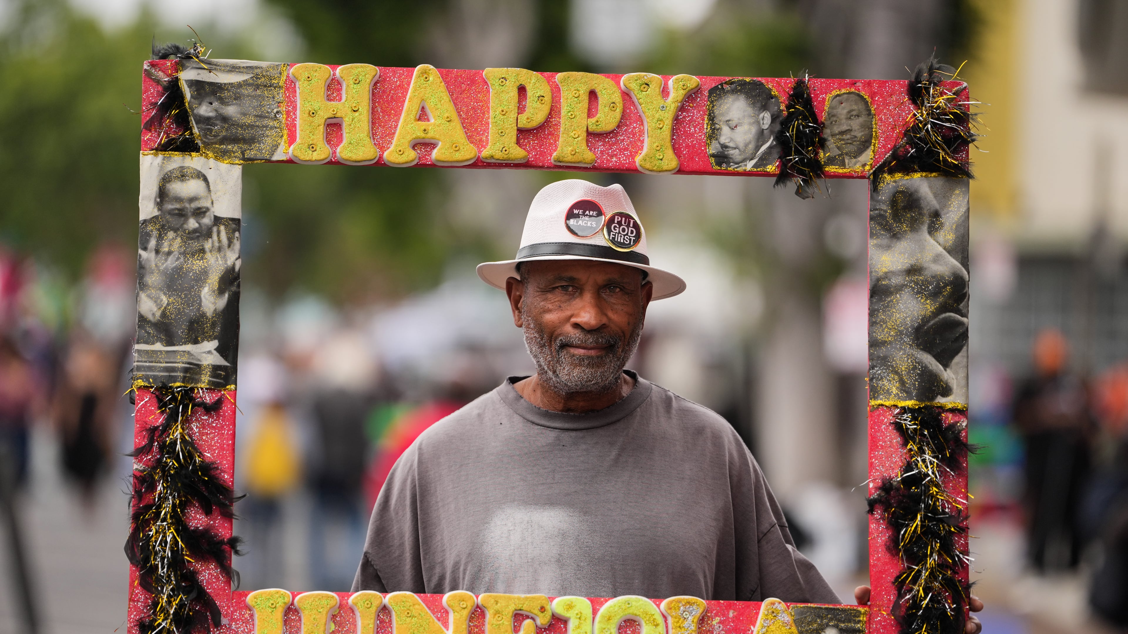 A person, who declined to give his name, stands for a photo during a Juneteenth celebration in the Leimert Park neighborhood of Los Angeles, Friday, June 19, 2026. (AP Photo/Jae C. Hong)