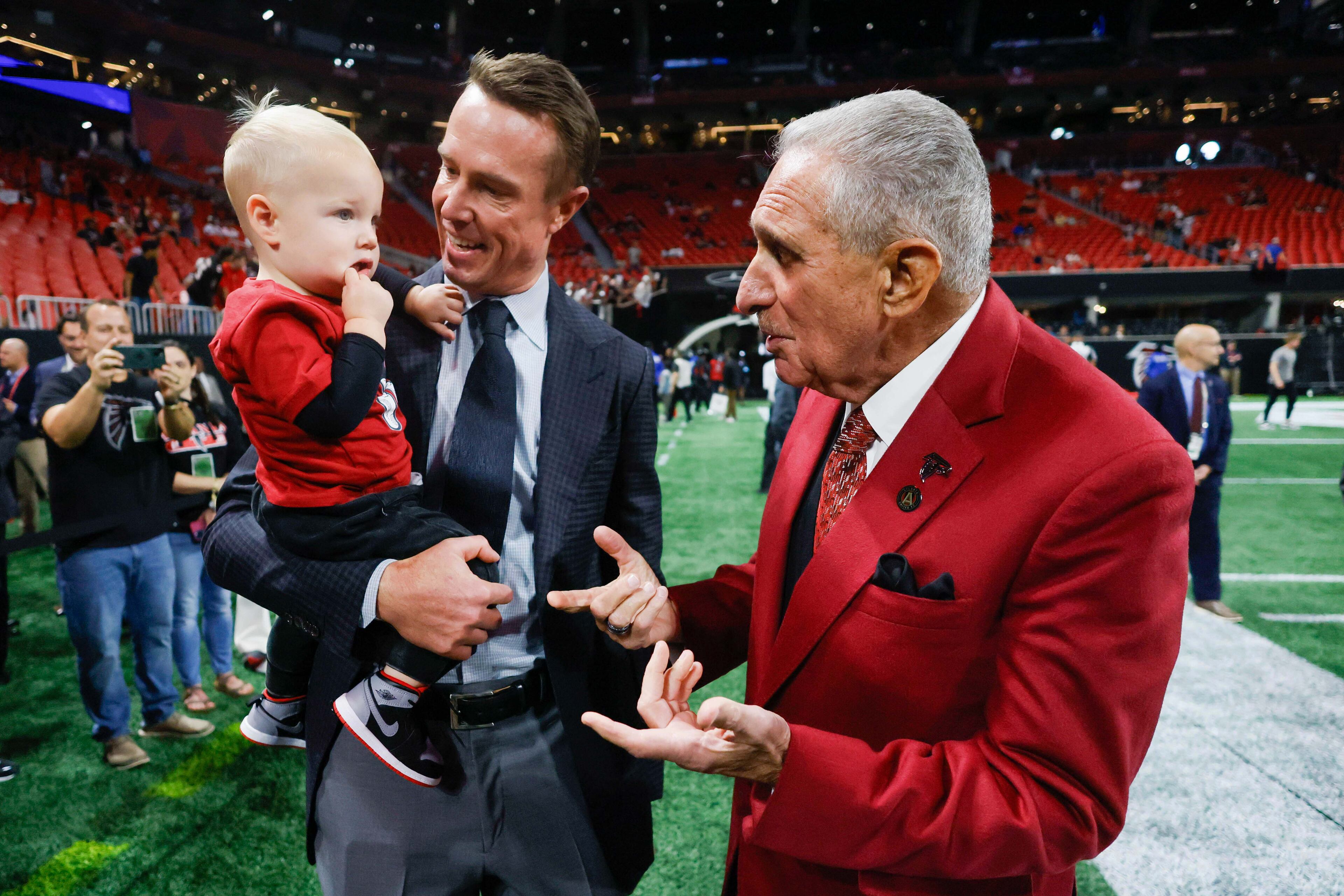 Atlanta Falcons owner Arthur Blank greets former Falcons quarterback Matt Ryan and his son Cal, 1.
(Miguel Martinez/ AJC)