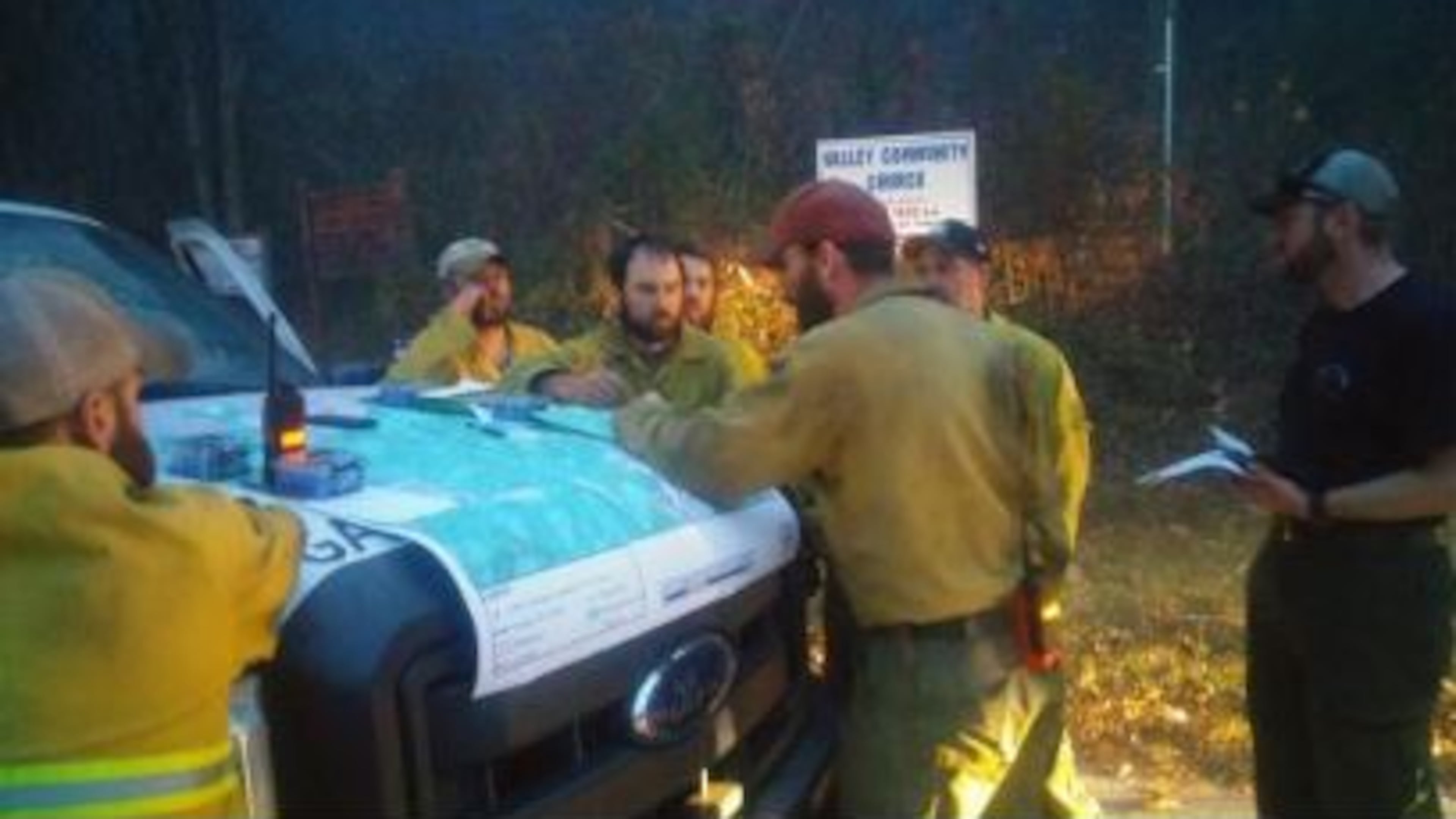 U.S. Forest Service officials discuss firefighting plans Friday in Rabun County. (Credit: The Clayton Tribune)