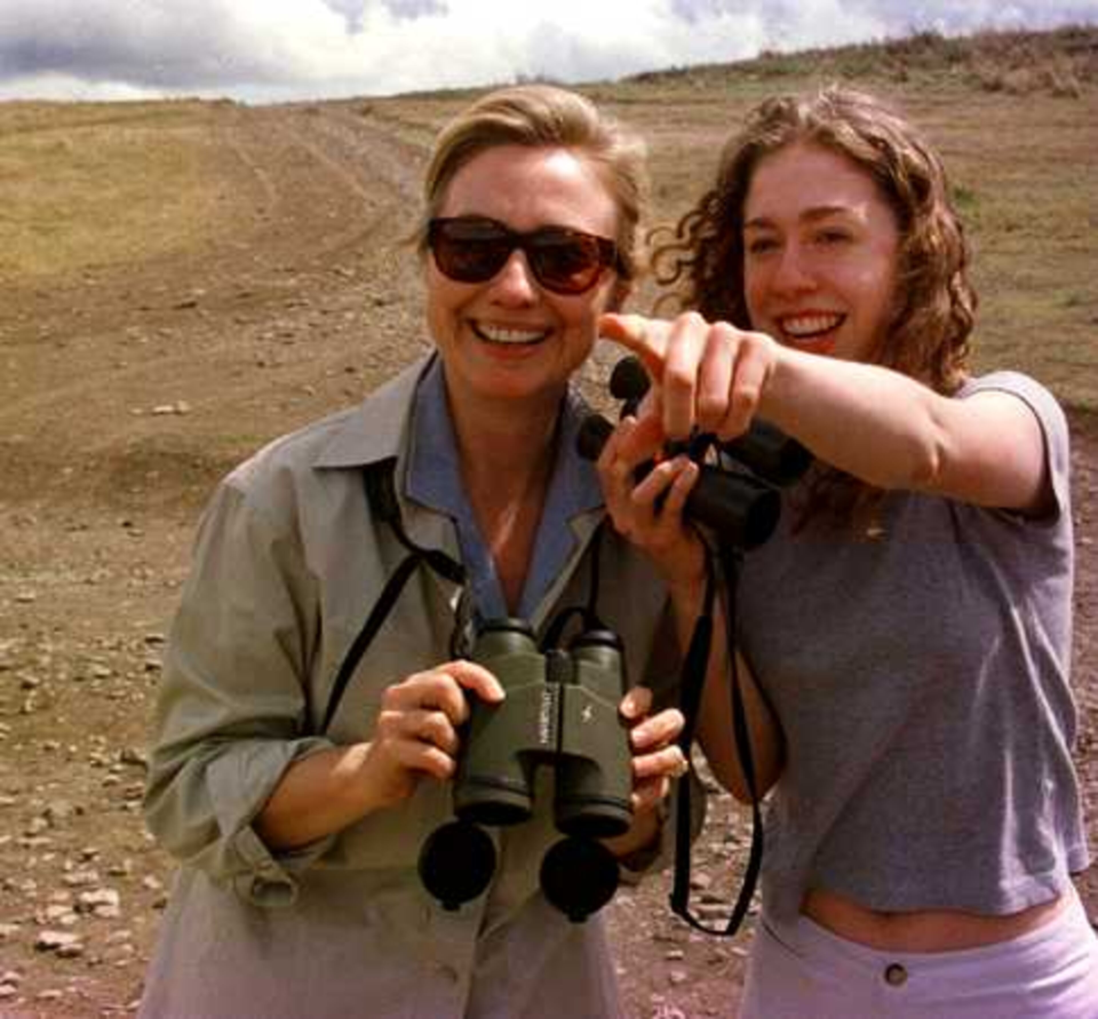 Chelsea Clinton points out a swamp full of hippopotamuses to her mother first lady Hillary Rodham Clinton during a morning safari in the Ngorongoro Crater in Tanzania in 1997.