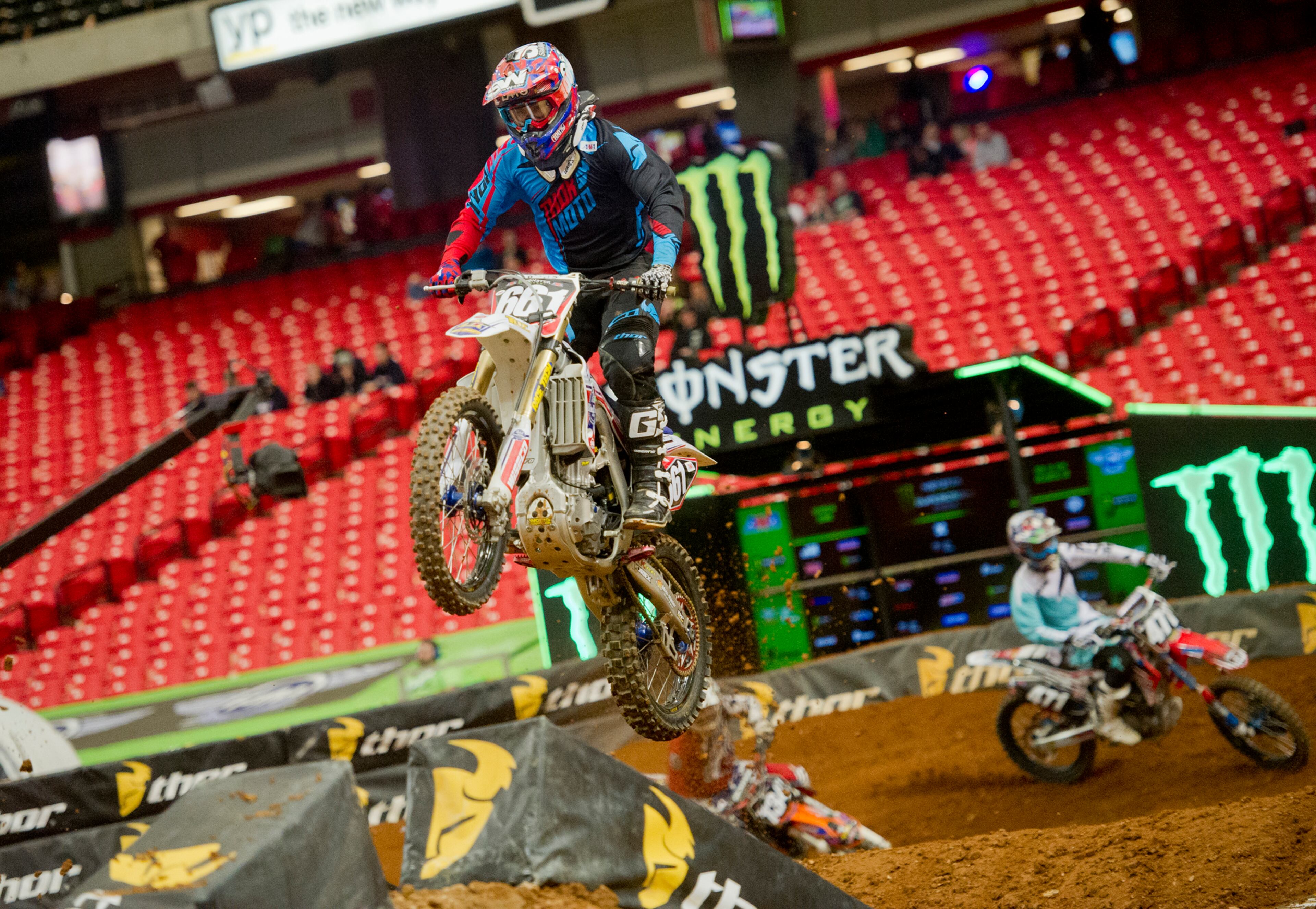 Michael Lang (661) catches some air as he competes in a qualifying round of the Monster Energy AMA Supercross FMI World Championship at the Georgia Dome in Atlanta on Saturday, February 22, 2014.