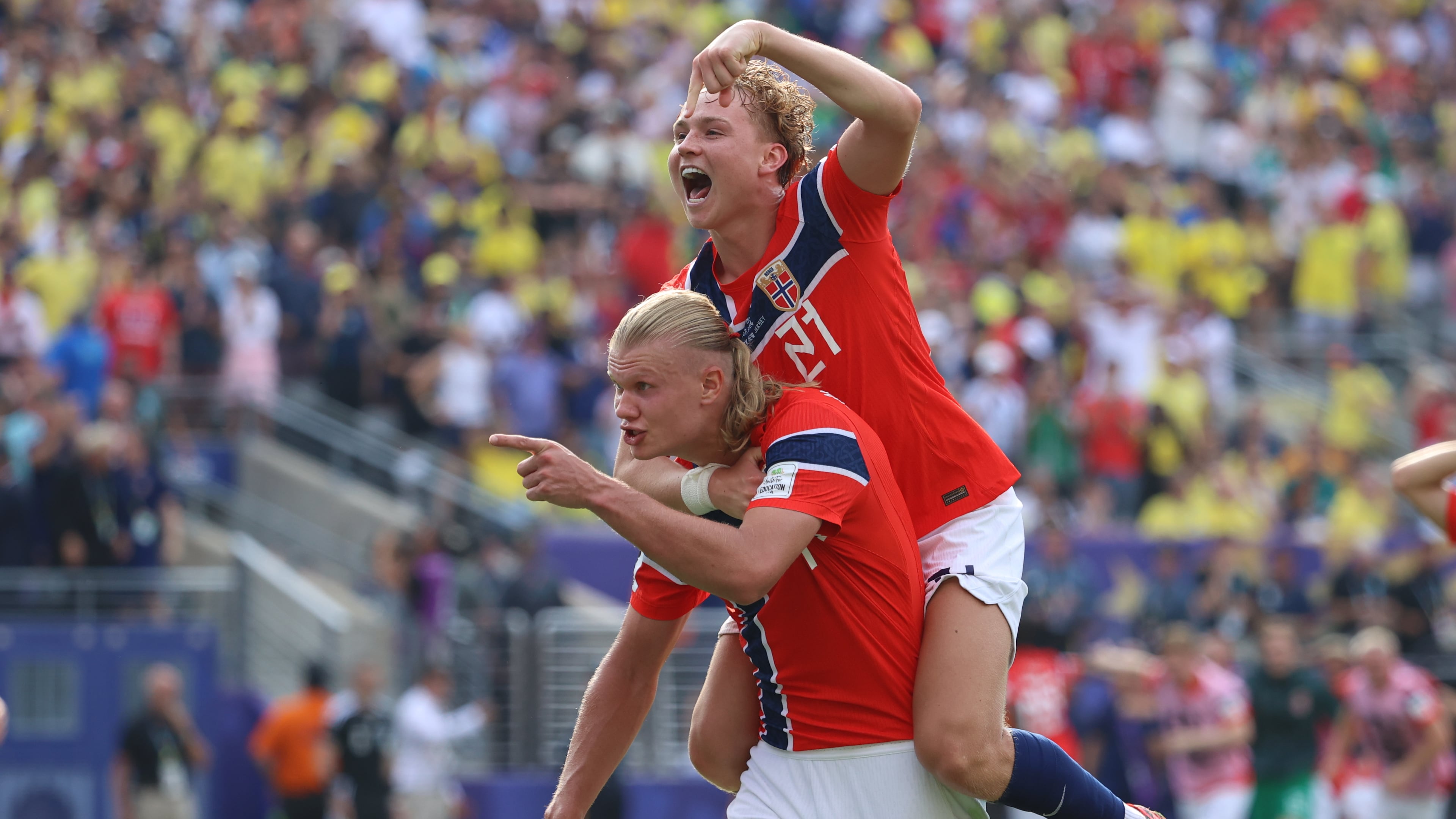 Norway's Erling Haaland (9) celebrates with Andreas Schjelderup (21) after scoring their second goal during the World Cup round of 16 soccer match between Brazil and Norway in East Rutherford, N.J., near New York, Sunday, July 5, 2026. (AP Photo/Pamela Smith)