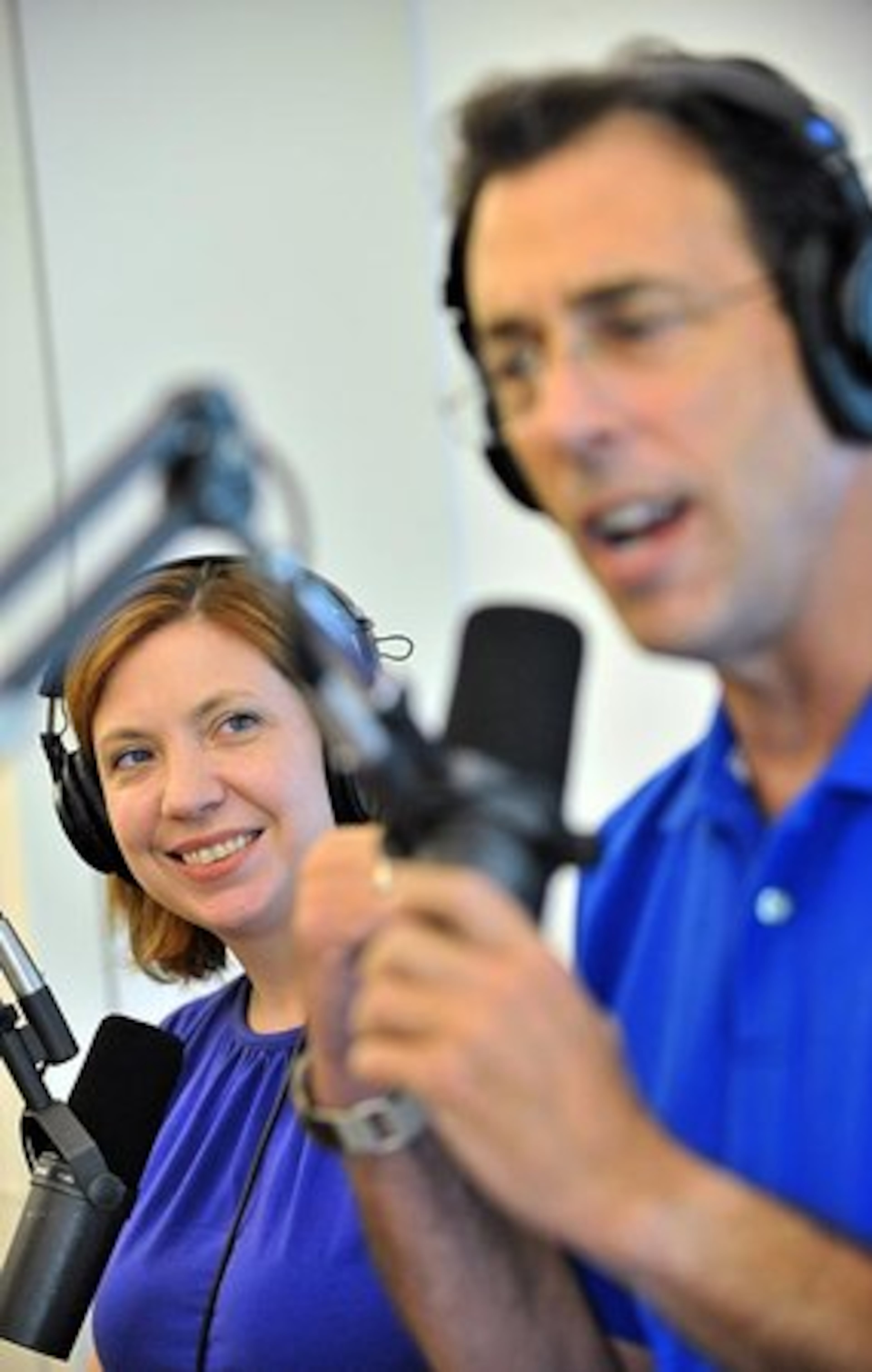 Radio talk show host and TV personality Clark Howard (foreground) talks as executive producer Christa DiBiase looks on during the tenth annual AM 750 and now 95.5 FM News/Talk WSB Care-a-Thon benefiting the Aflac Cancer Center and Blood Disorders Service of Children's Healthcare of Atlanta on Thursday, Aug. 26, 2010.