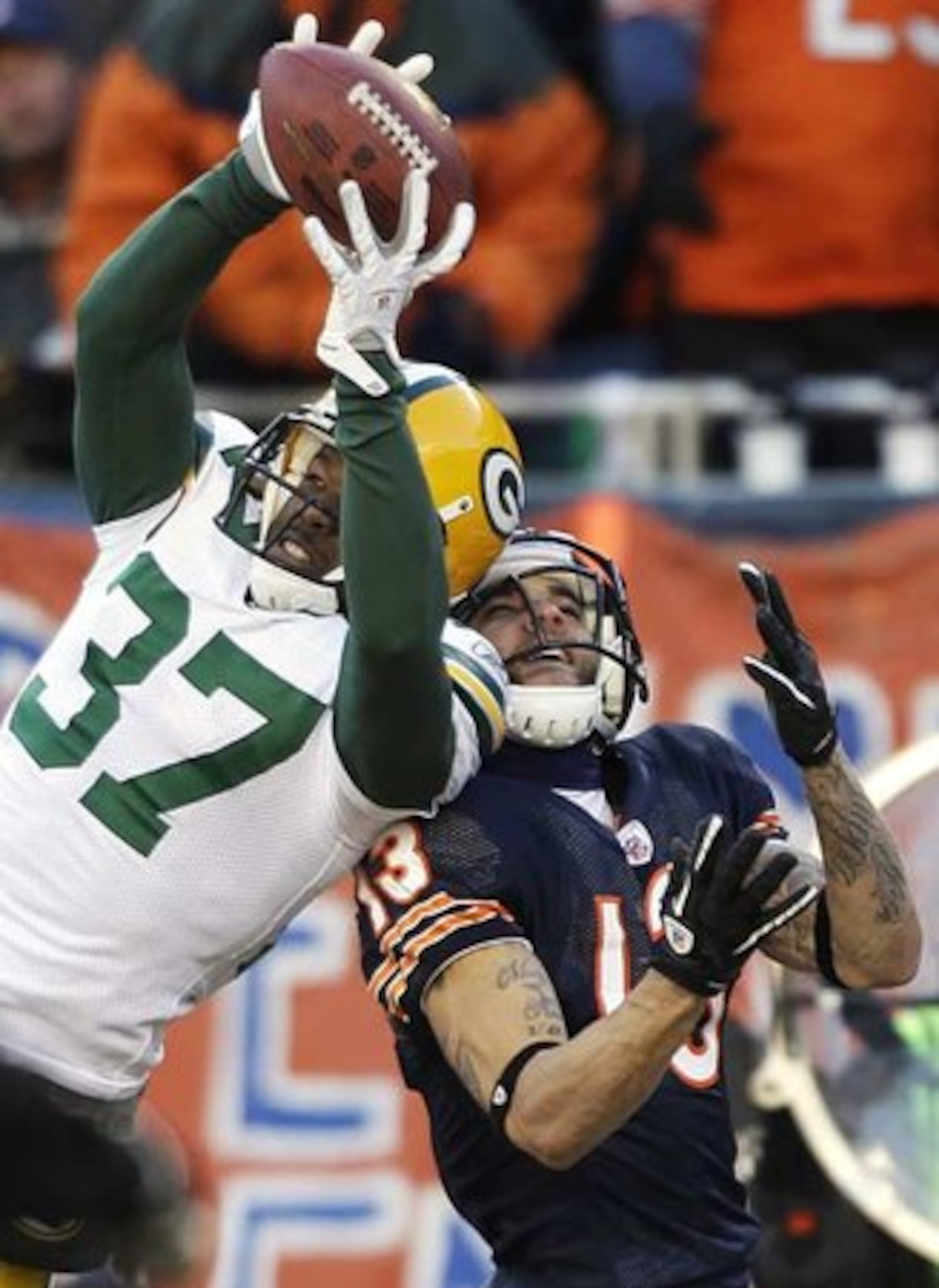 Packers cornerback Sam Shields intercepts a pass intended for Bears wide receiver Johnny Knox (13) during the first half of the NFC Championship.