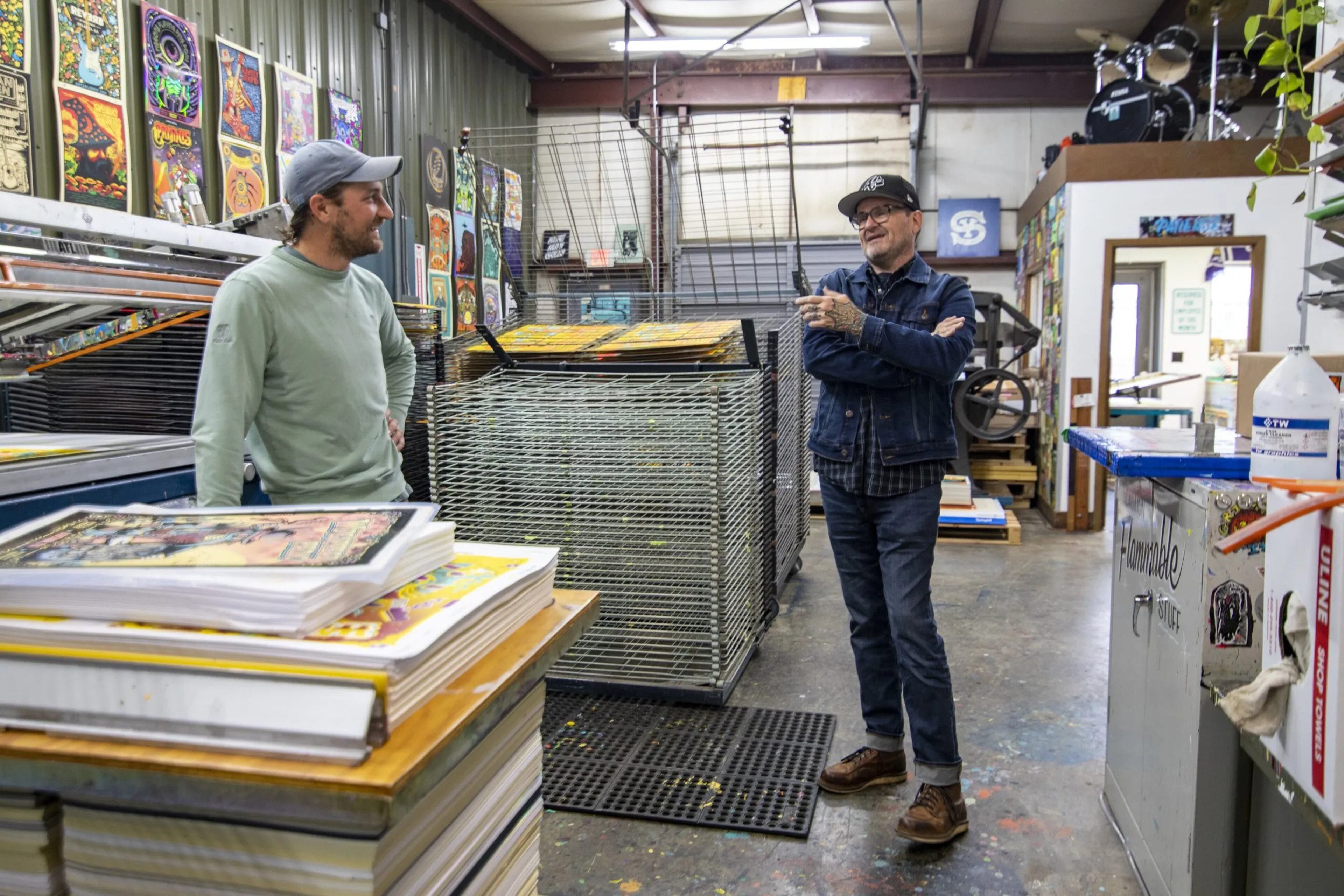 Brandon McDonald, left, discusses WigWag 2023 with Robert Lee, right, in Backside Press. (Photo Courtesy of Isadora Pennington)