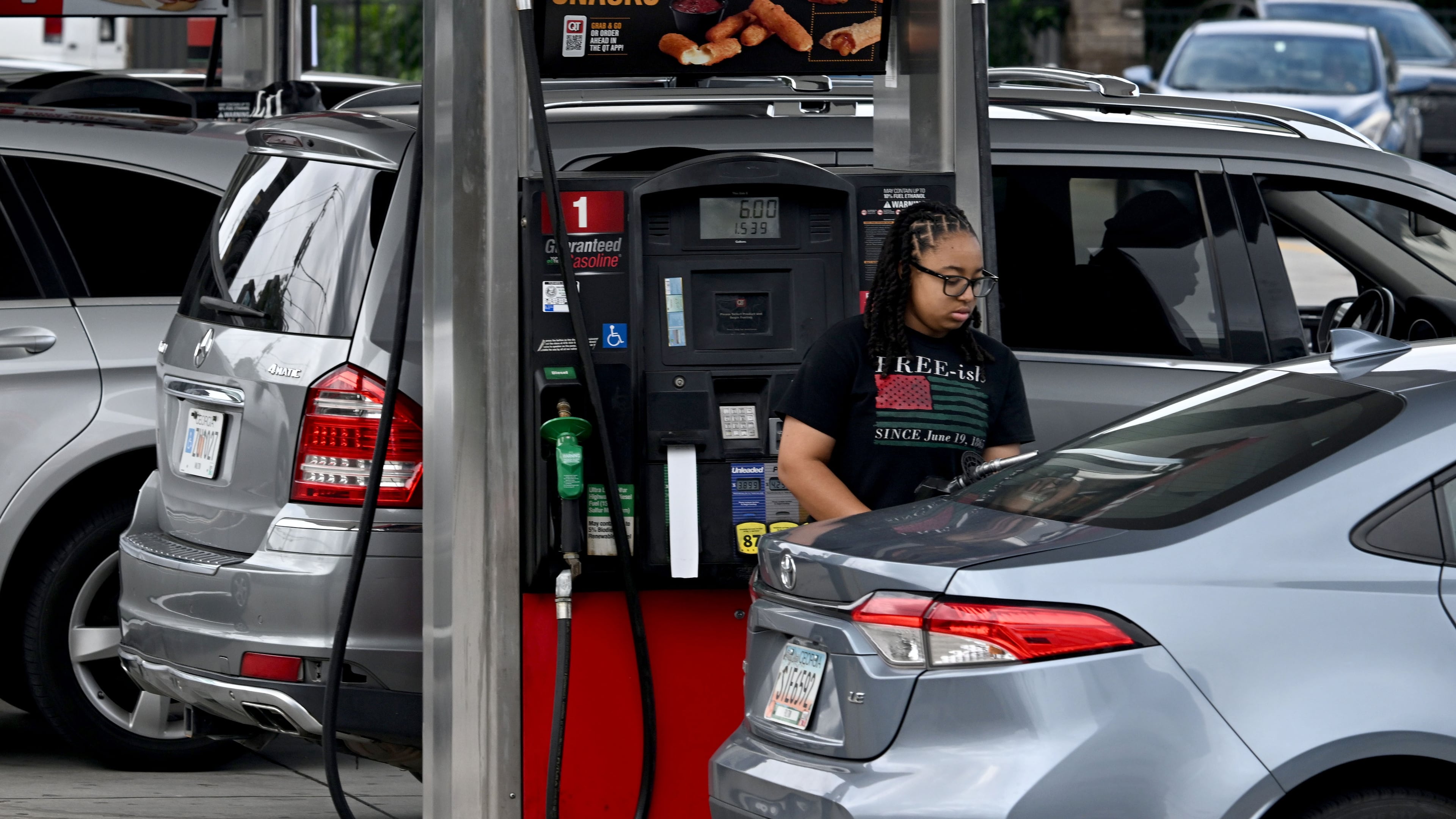 Customers fill up fuel tanks at a QuikTrip station on Northside Drive on Tuesday, July 14, 2026, in Atlanta. (Hyosub Shin/AJC)