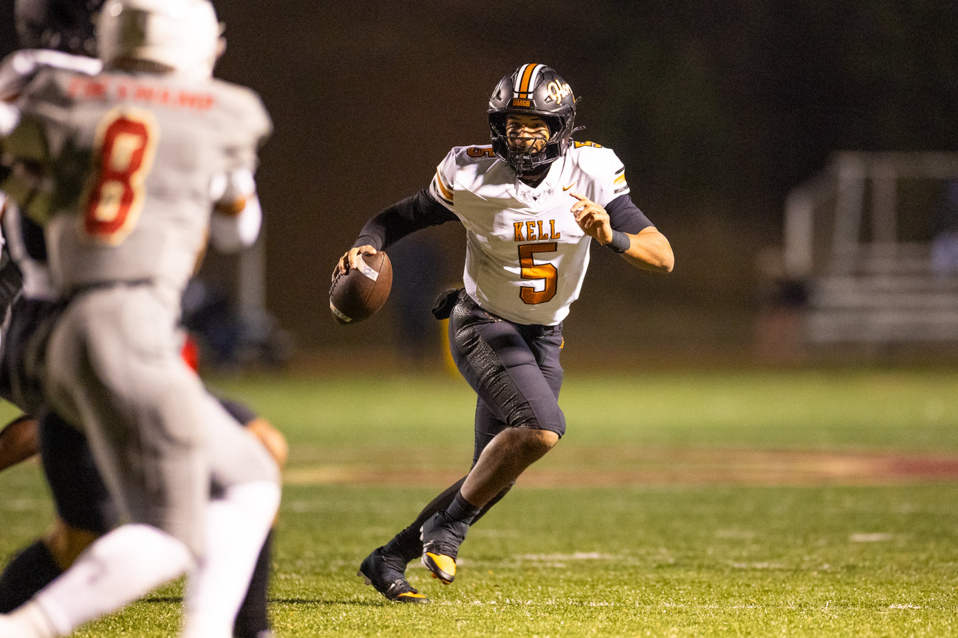 Kell quarterback Kaleb Narcisse runs with the ball during the Class 4A semifinal against Creekside on Friday, Dec. 5, 2025, at Creekside High School in Fairburn. (Oscar Guevara Saenz for the AJC)
