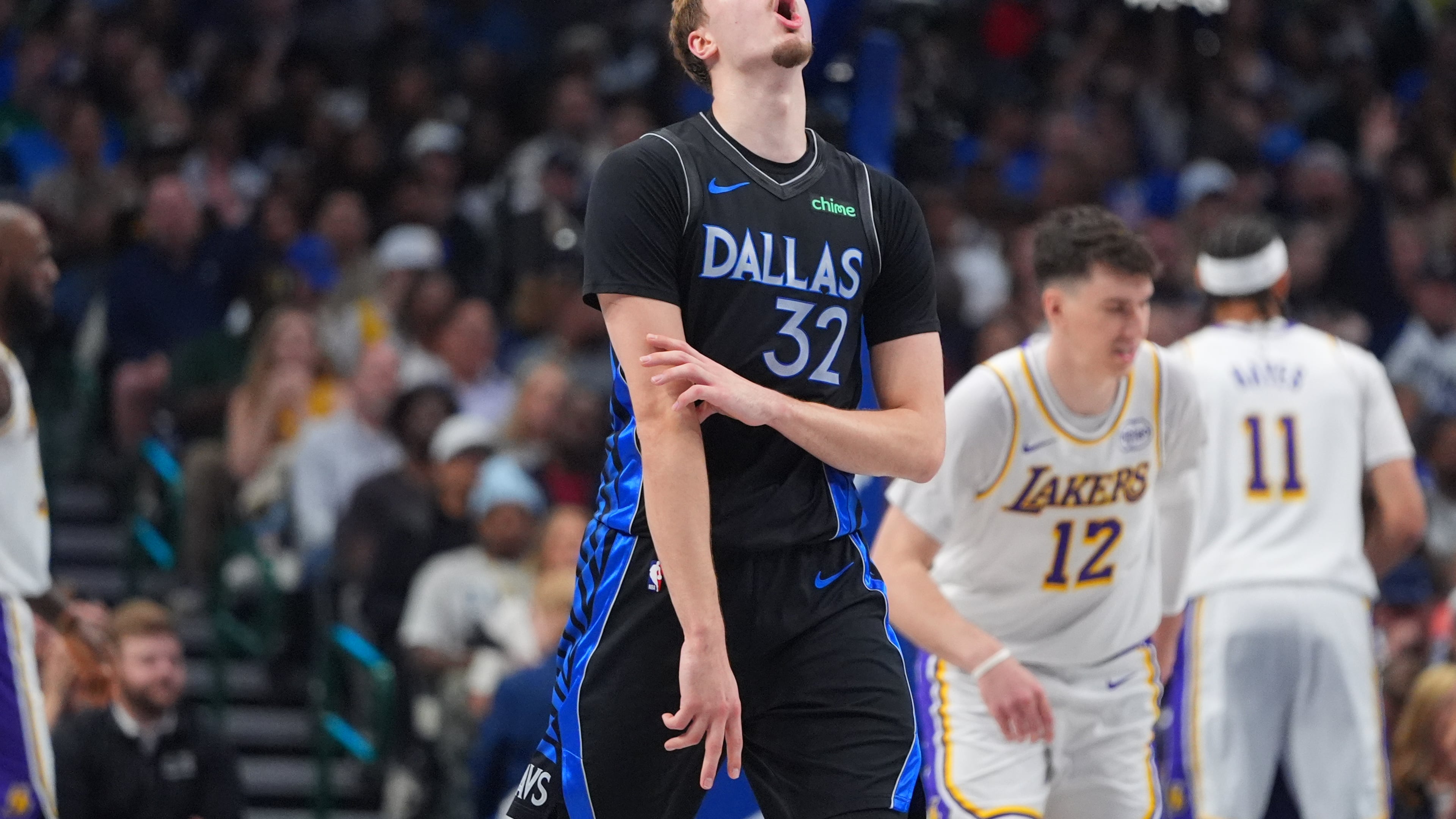 Dallas Mavericks forward Cooper Flagg (32) reacts to a score during the first half of an NBA basketball game against the Los Angeles Lakers in Dallas, Sunday, April 5, 2026. (AP Photo/LM Otero)