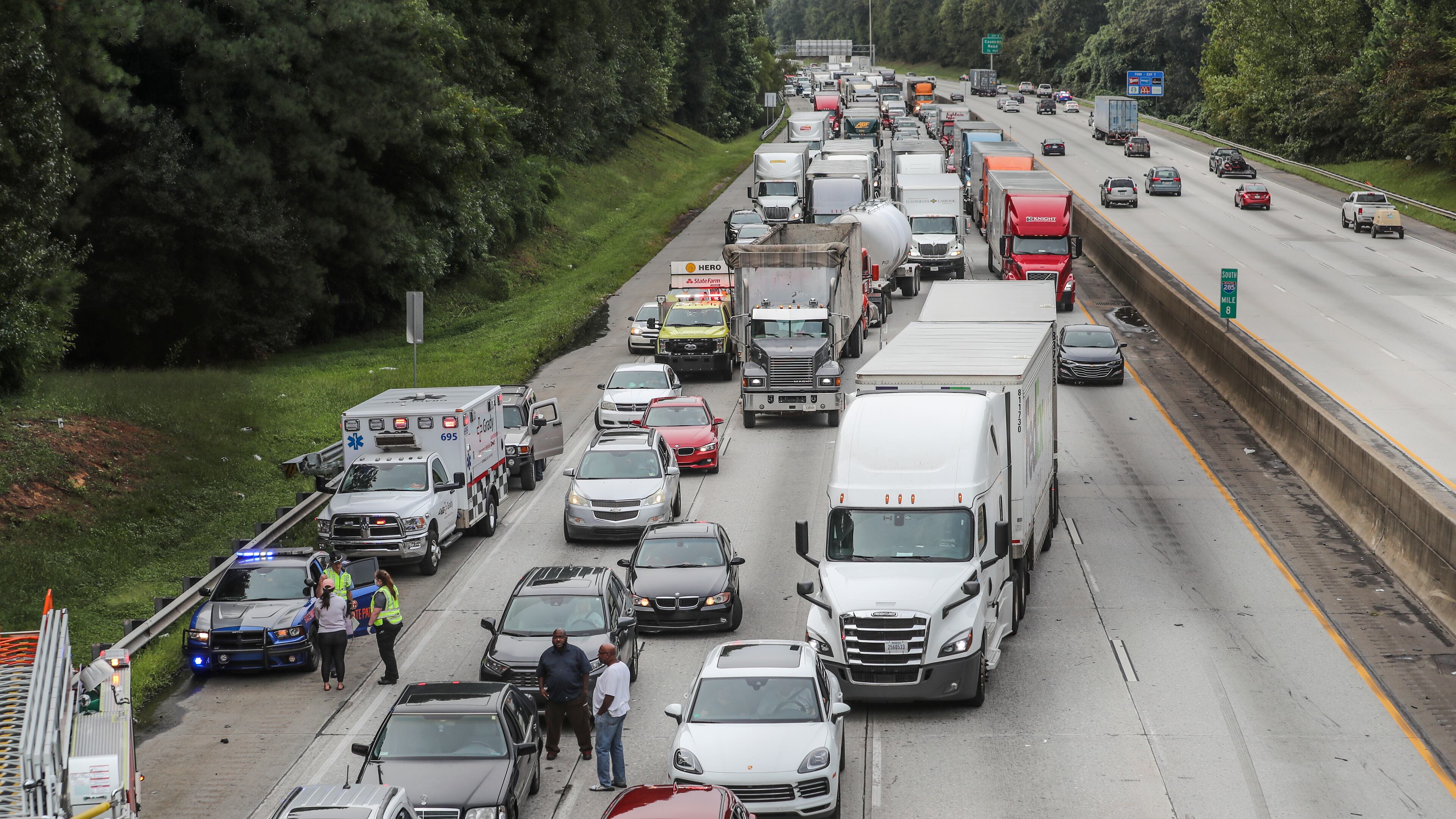 September 18, 2020 Atlanta: All lanes of Northbound I-285 were shut down Friday morning, Sept. 18, 2020 after a widely scattered crash involving a tractor-trailer near Cascade Road. 2-hours later lanes began to reopen. It is unclear what prompted the wreck, which appeared to involve the truck and a Toyota Camry that caught fire after the crash. The collision occurred about 8:30 a.m., according to the the WSB 24-hour Traffic Center. Debris was scattered across the roadway, prompting police to shut down the interstate north of the Cascade Road exit. The closure caused backups on the inner loop back to Langford Parkway, the Traffic Center reported. Lanes started reopening about 10:30 a.m., but there are still heavy delays in the area. Drivers are urged to avoid the backups by taking the Downtown Connector, Fulton Industrial Boulevard or Campbellton Road. (John Spink / John.Spink@ajc.com)