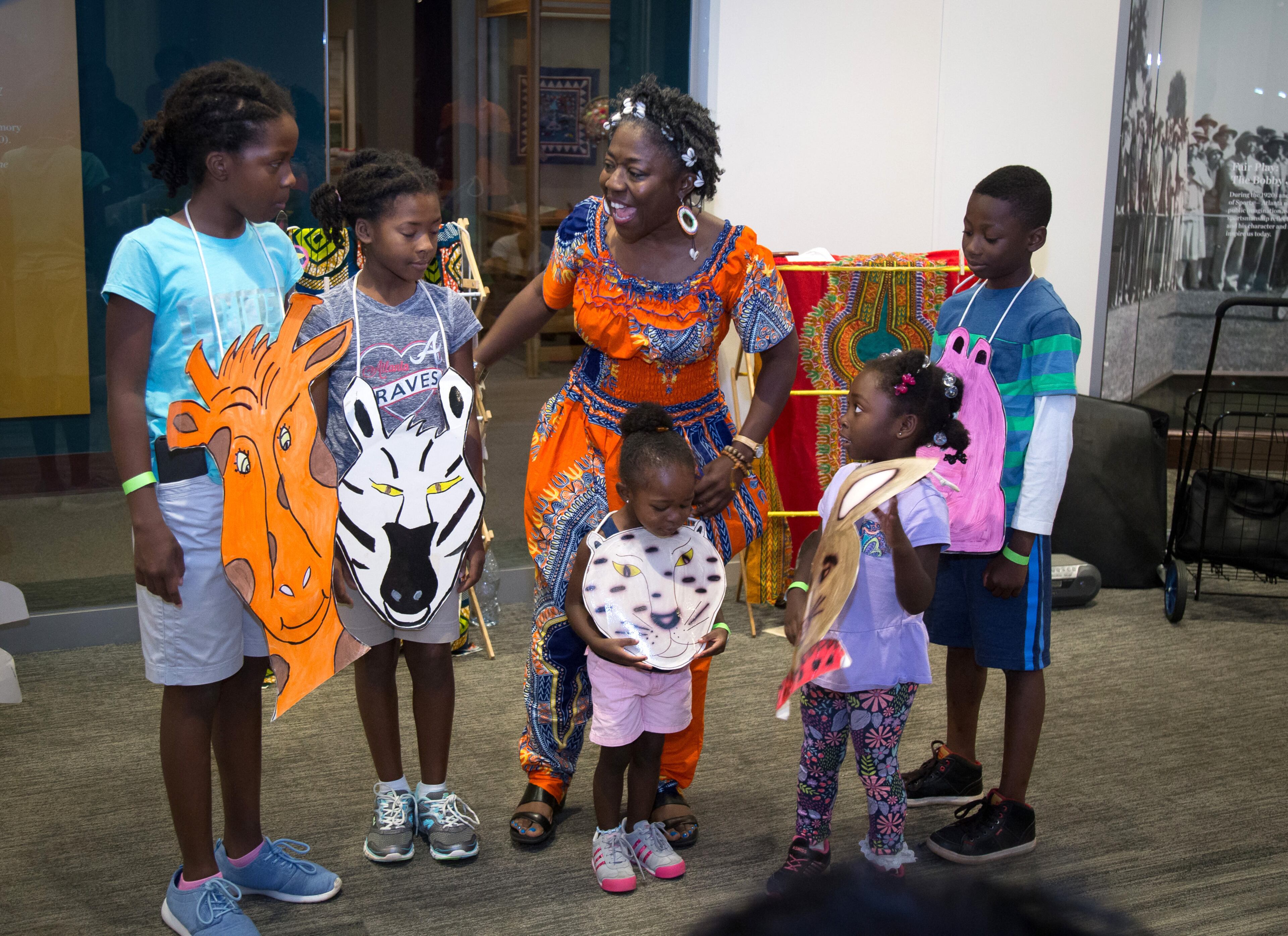 Storyteller Mama koku acts out stories with help from the audience Saturday at the Atlanta History Center during the center's Juneteenth Jubilee, June 17, 2017. Juneteenth is a celebration commemorating the end of slavery in the United States. STEVE SCHAEFER / SPECIAL TO THE AJC