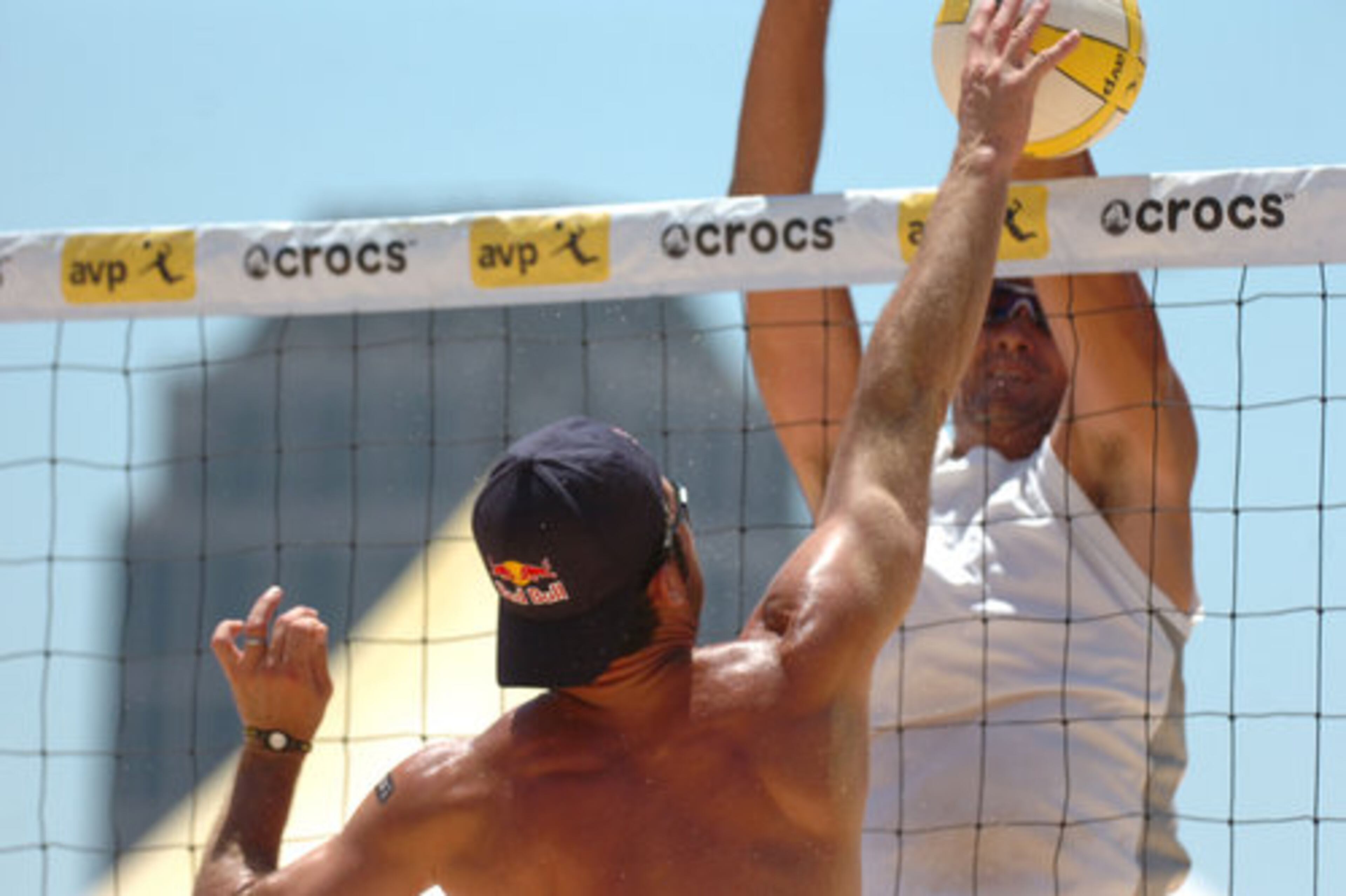 Todd Rogers goes up against the block by Kevin Wong.