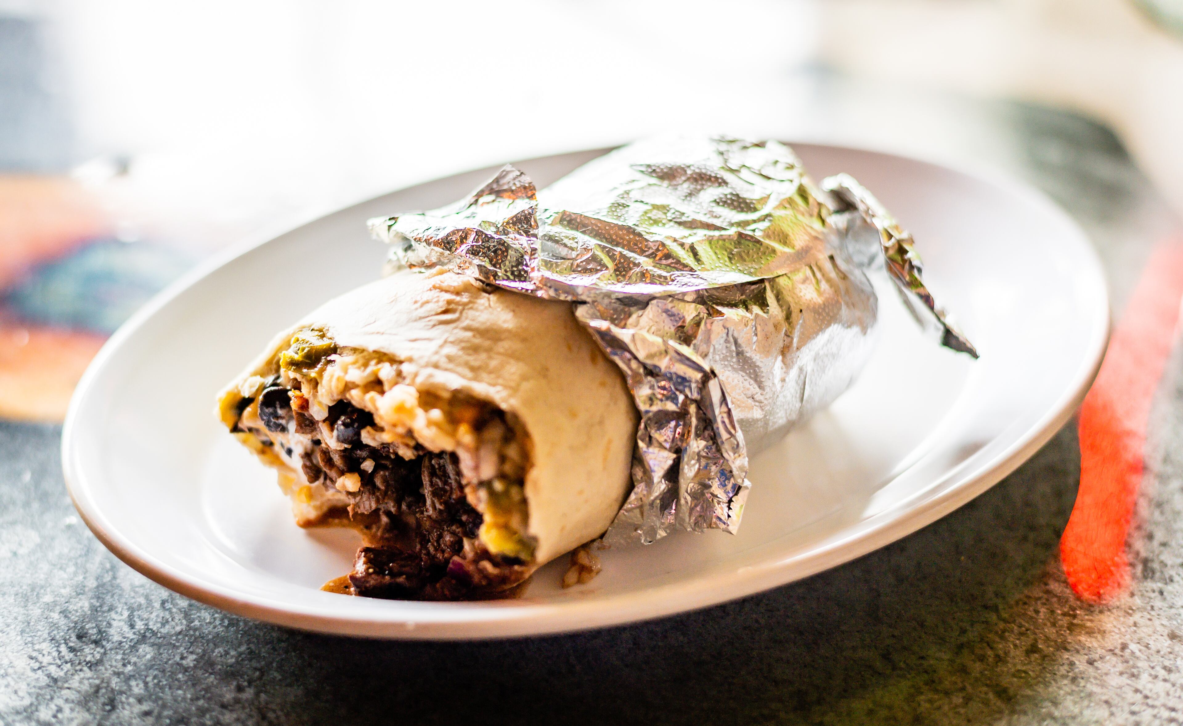 The Cajun Killer burrito at Raging Burrito on Decatur Square is great because it melds flavors according to an actual culinary theme. CONTRIBUTED BY HENRI HOLLIS