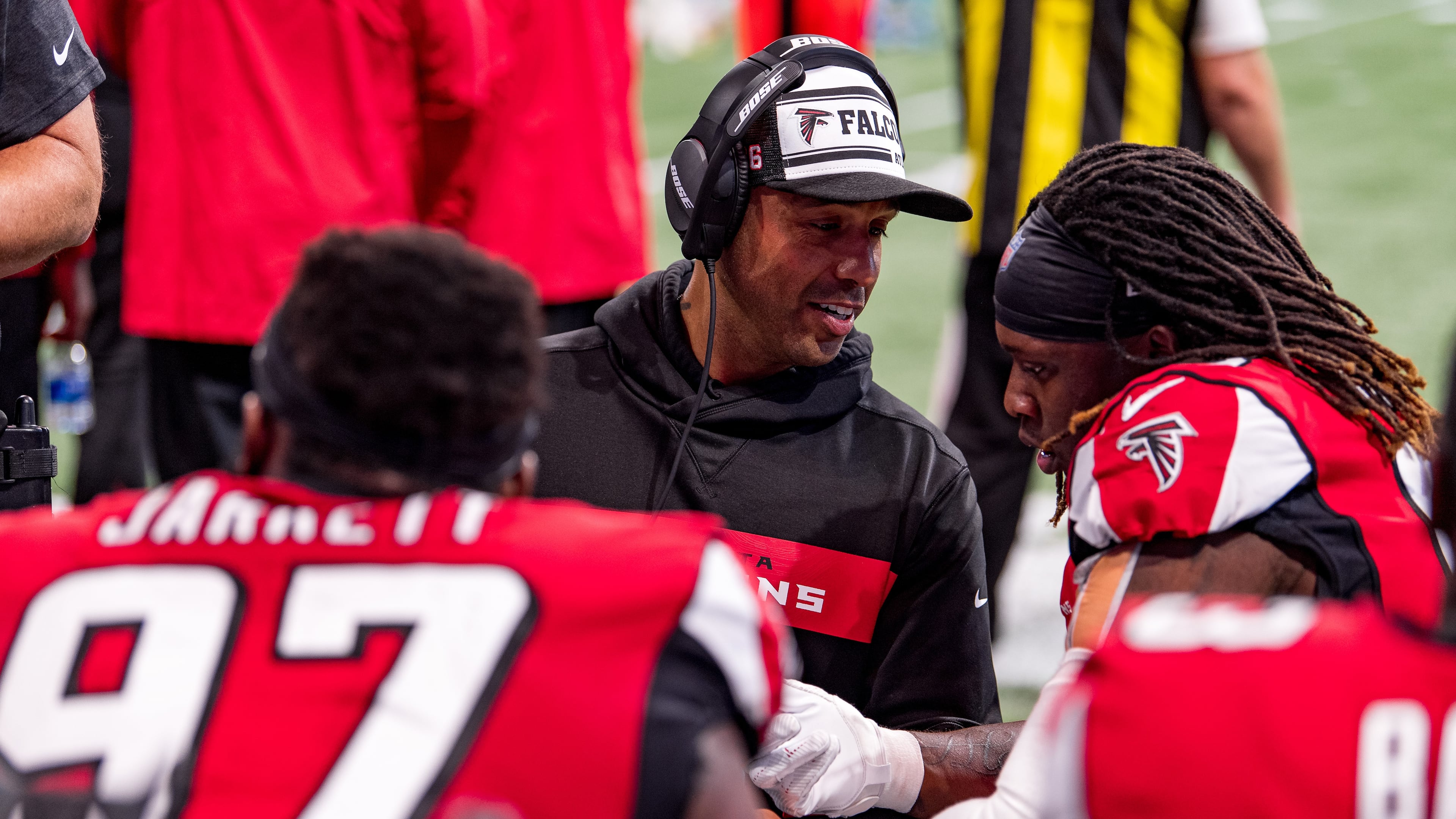 Falcons defensive coach Aden Durde speaks with defensive end Takk McKinley during a game against the Carolina Panthers at Mercedes-Benz Stadium on Sunday Dec. 8, 2019. (Photo by Rob Foldy/Atlanta Falcons)