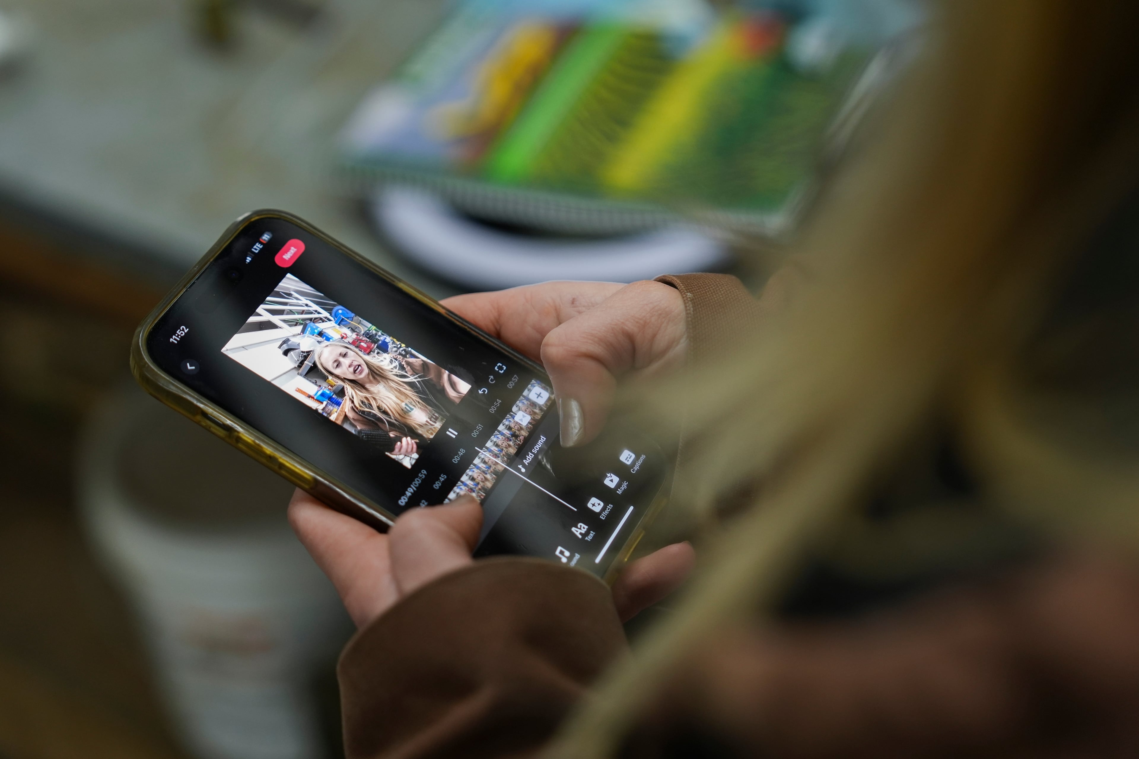 Zoe Kent edits a social media video on the TikTok app, Jan. 20, 2025, at her farm in Bucyrus, Ohio. (Joshua A. Bickel/AP)