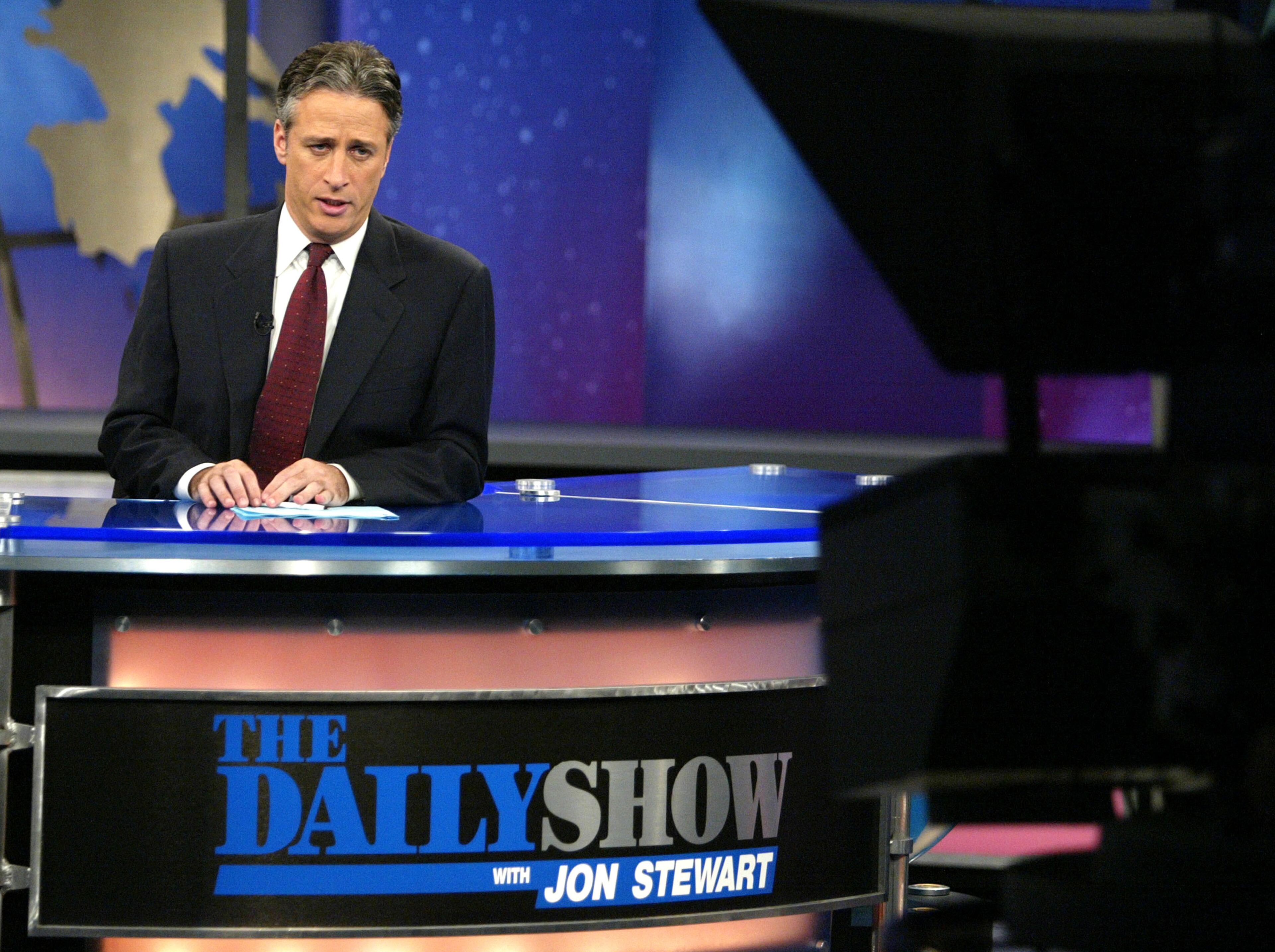 Host Jon Stewart is seen on Comedy Centrals "The Daily Show" August 9, 2004 in New York City. (Photo by Peter Kramer/Getty Images)