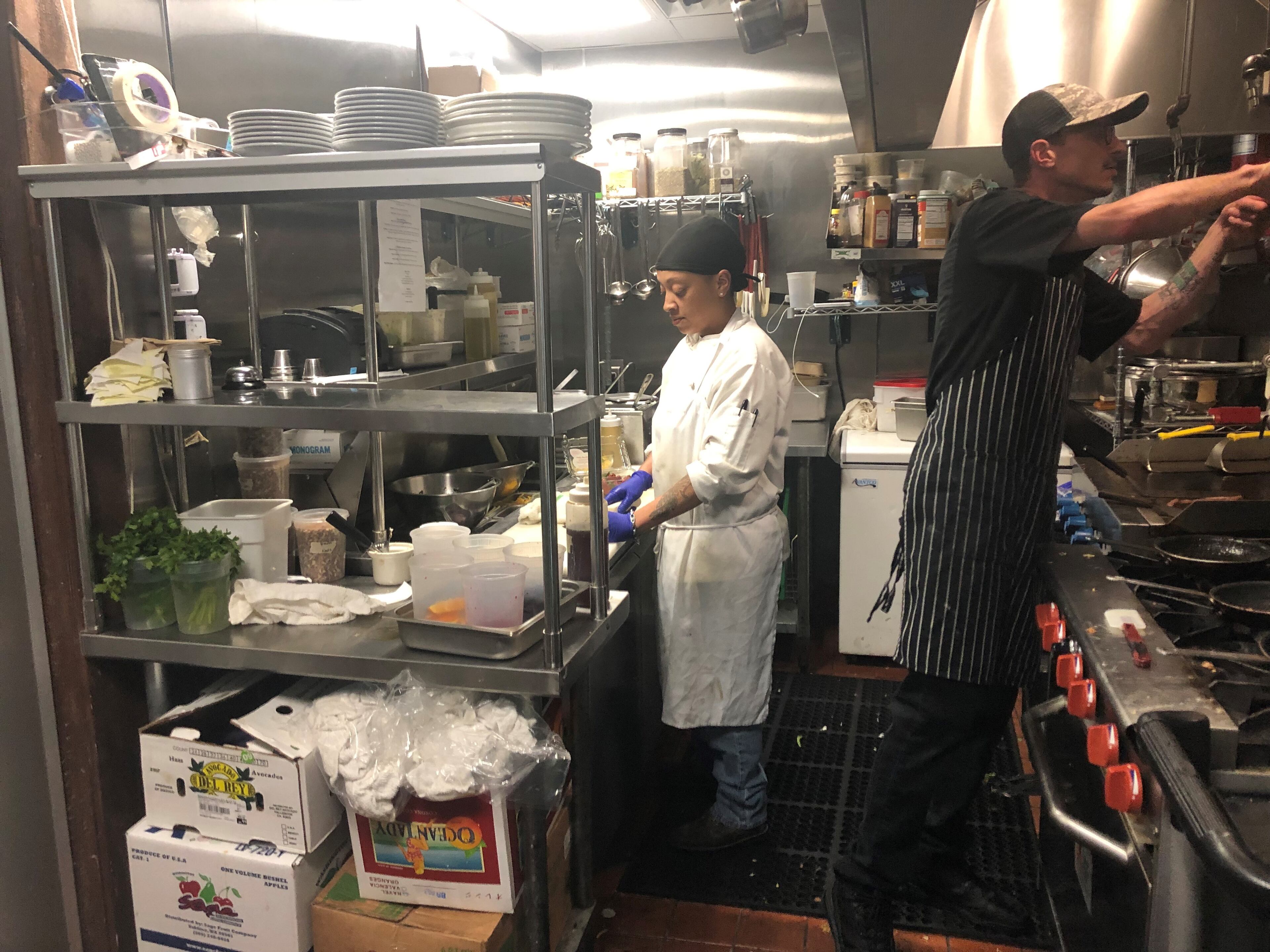 Garrett Wheeler (right) and Ali Ramerez work in the small kitchen at Petit Chou in Cabbagetown.