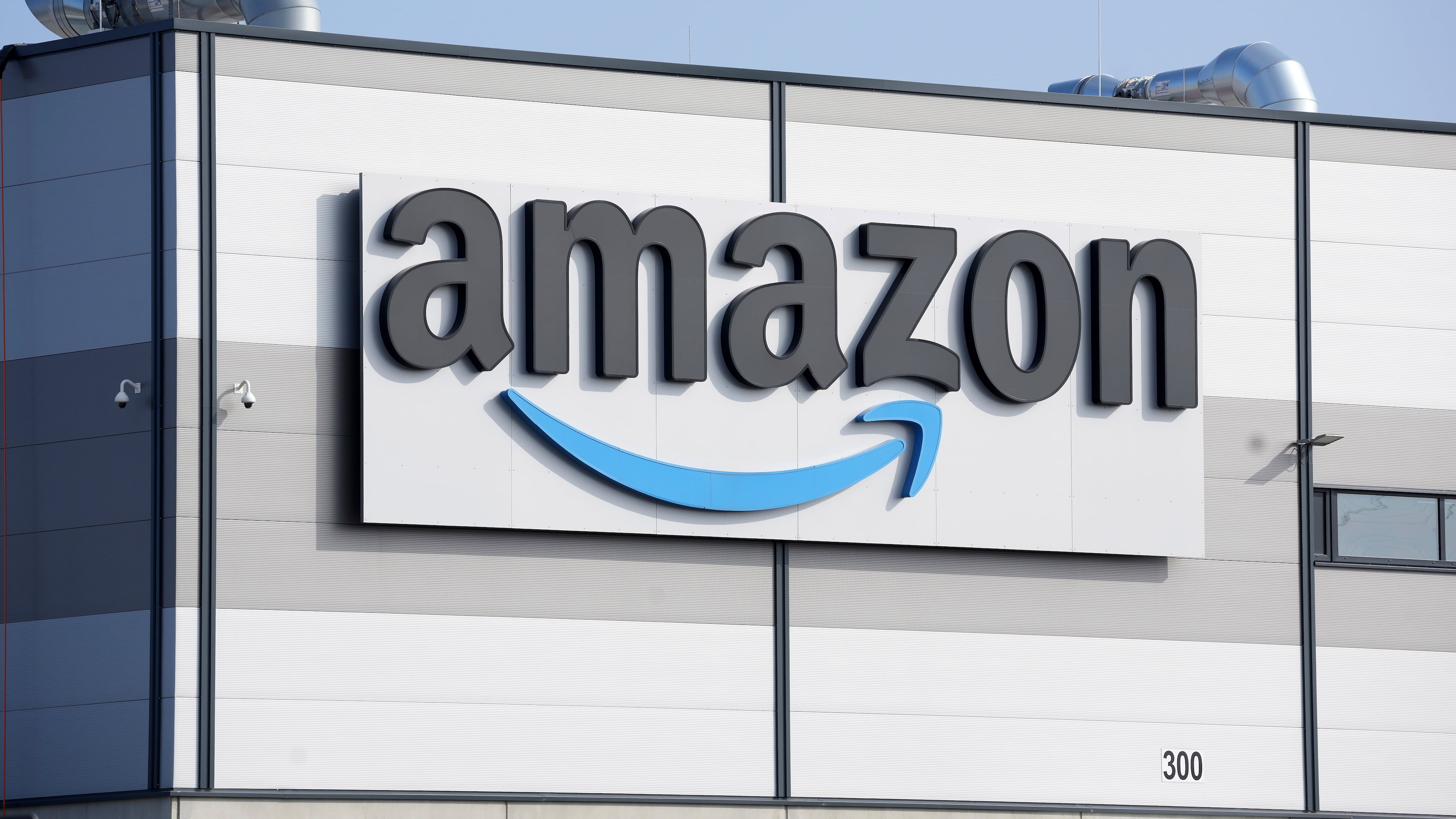 FILE - An Amazon company logo marks the facade of a building, March 18, 2022, in Schoenefeld near Berlin. (AP Photo/Michael Sohn, File)