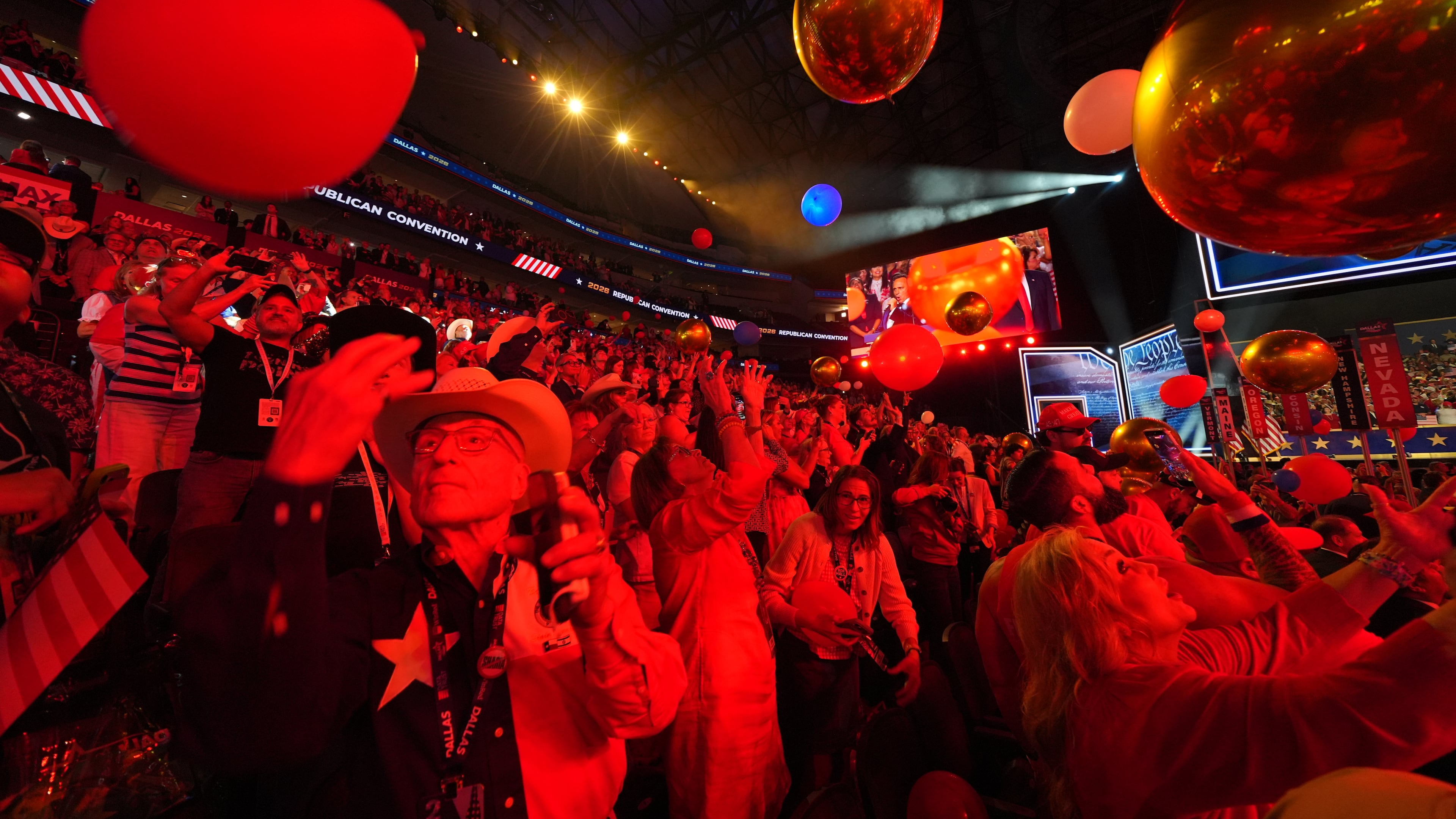 Attendees cheer at the end of the Republican midterm convention on Thursday in Dallas. (Julio Cortez/AP)